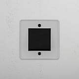 Interruttore bilanciere singolo intermedio versatil in bronzo trasparente nero: controllo della luce su sfondo bianco.