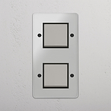 Interruttore Bilanciere Verticale Doppio in Nichel Lucido Trasparente Nero - Sistema di Illuminazione Efficace su Sfondo Bianco
