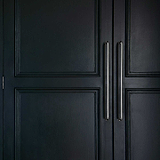 Polished Nickel Sycamore Furniture Handle on black Cupboards
