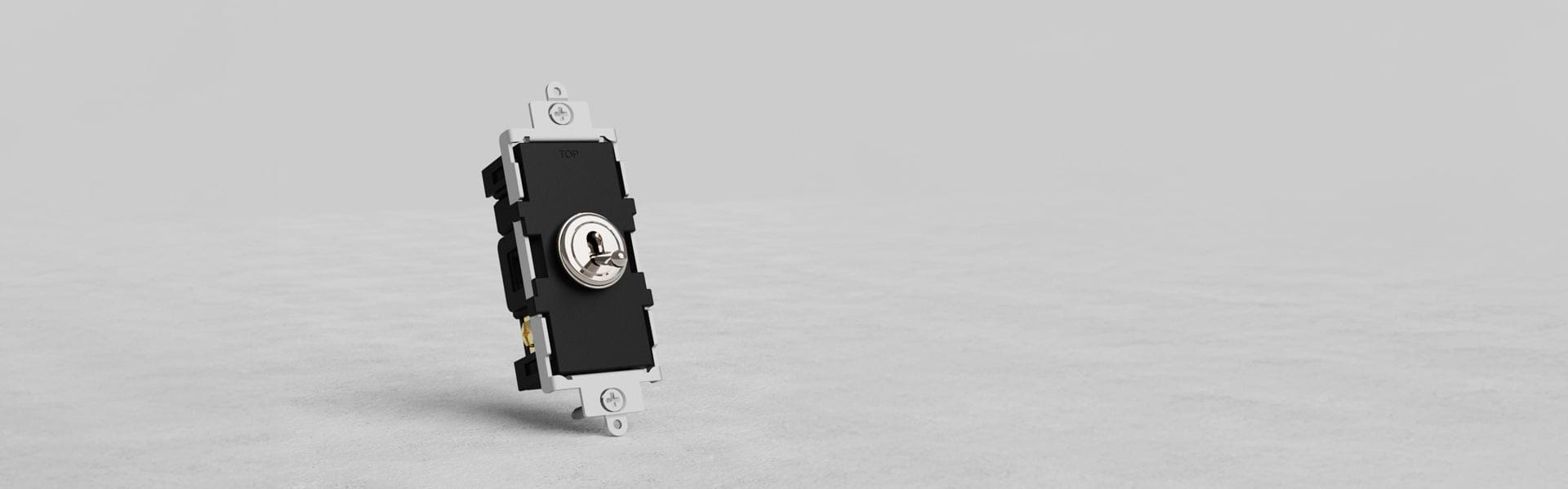 A close-up of a black electrical switch with a round toggle in the center, mounted on a white base, set against a light gray background.
