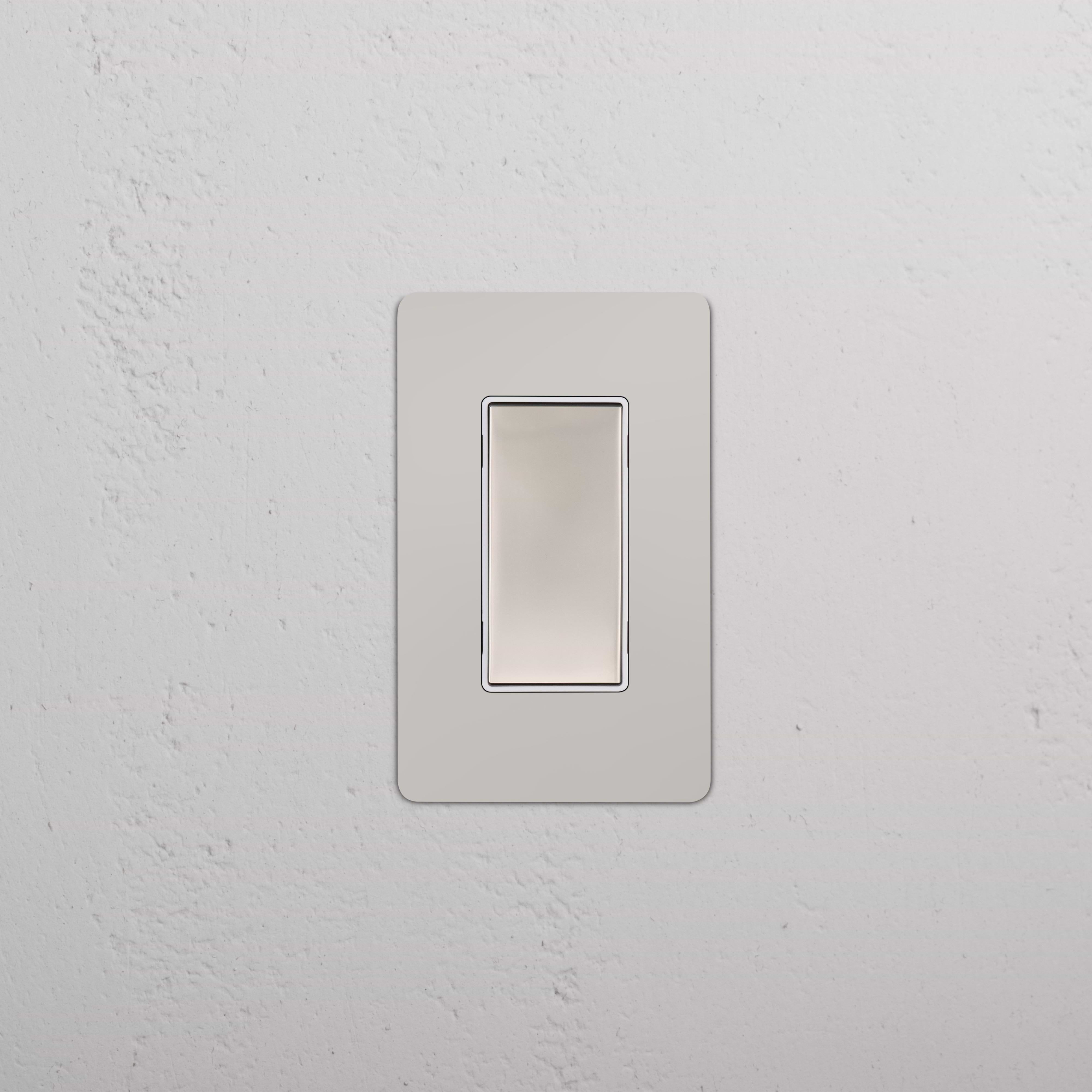 Kew 1G Center Retractive Rocker Switch in polished nickel white with a sleek, modern rectangular design.