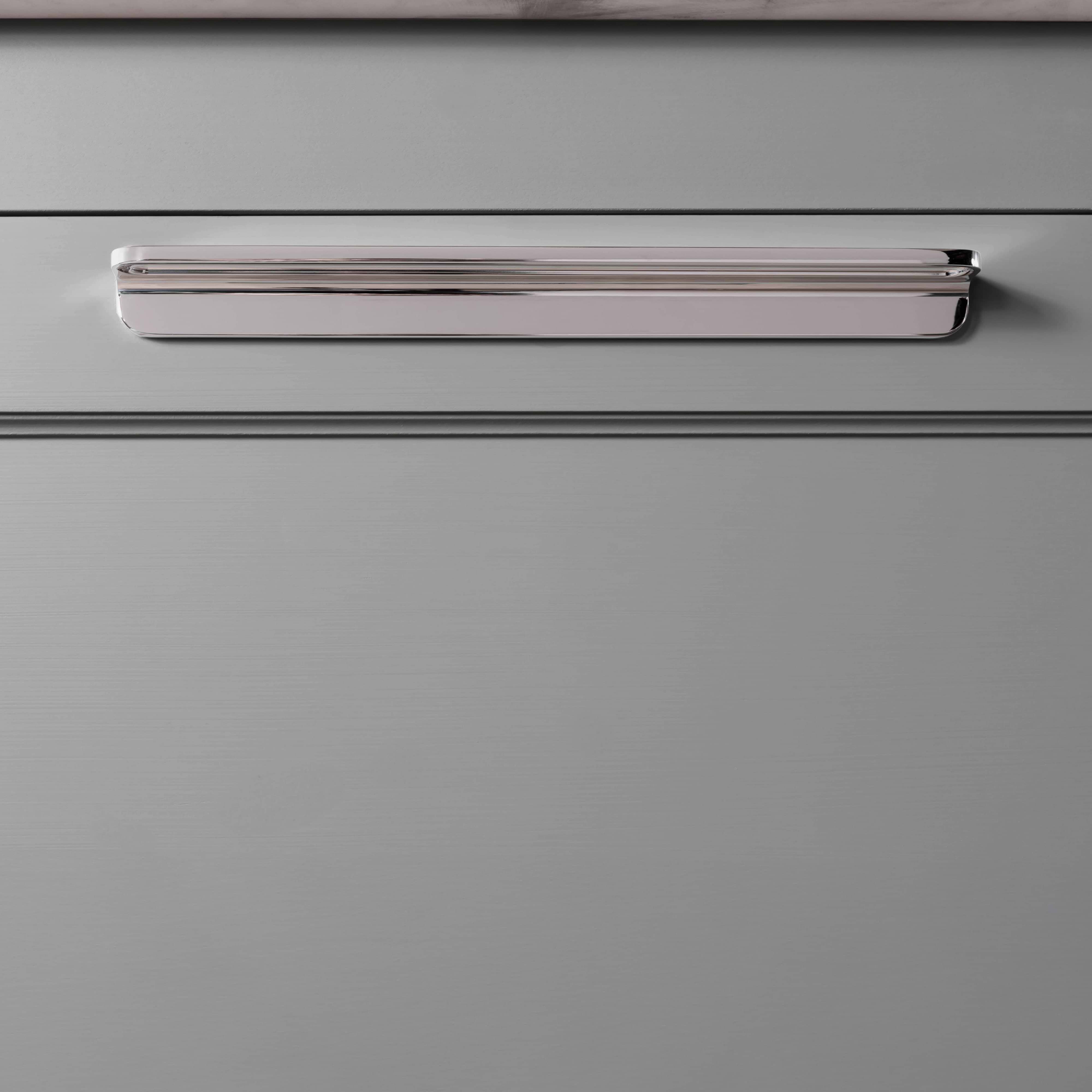 Close-up of the Oxford Furniture Handle Large in polished nickel, installed on a light gray drawer front.