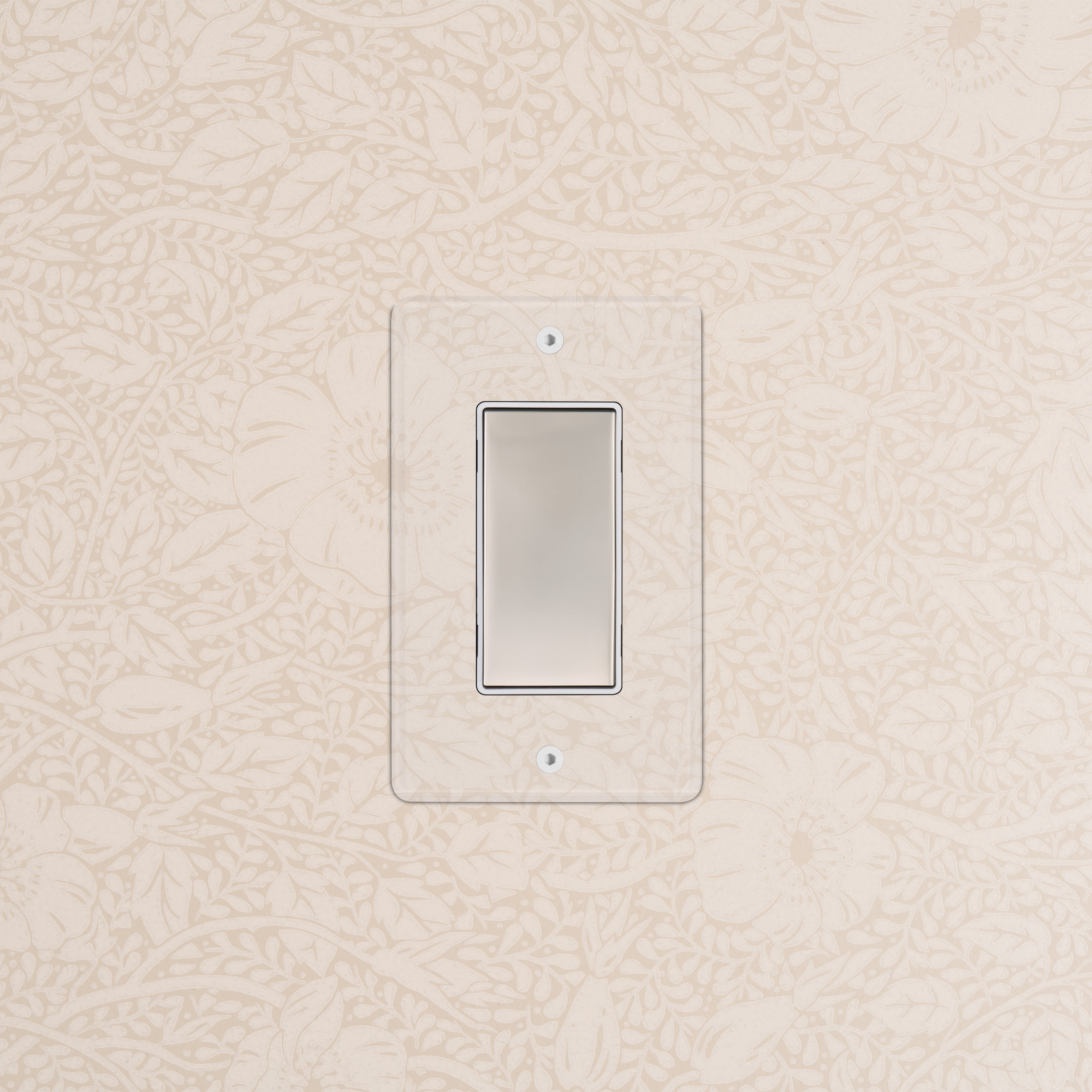 Kew 1G Center Retractive Rocker Switch with clear polished nickel white plate on a patterned beige wall.