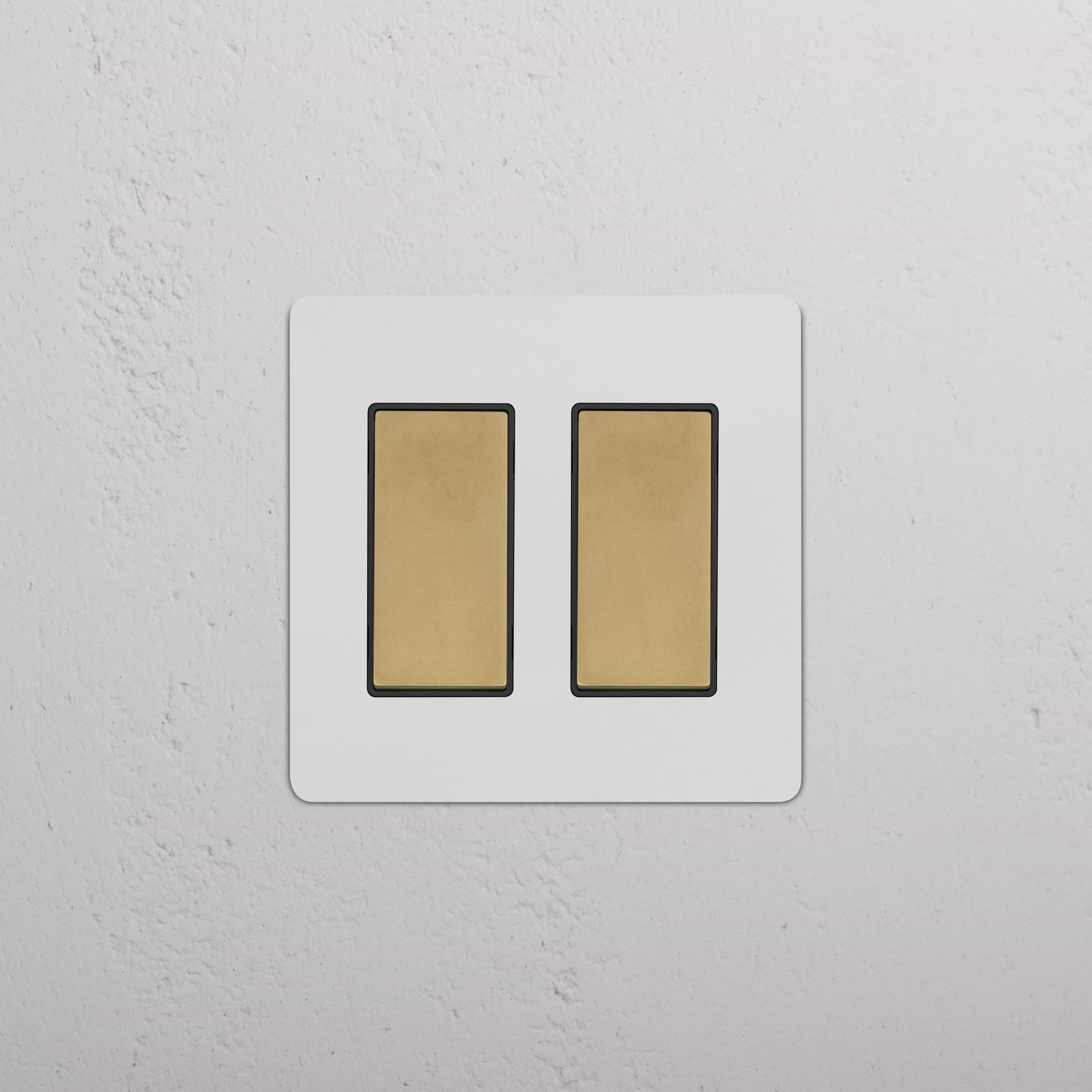 Kew 2G Rocker Switch in paintable antique brass black finish with two black rectangular rocker switches.