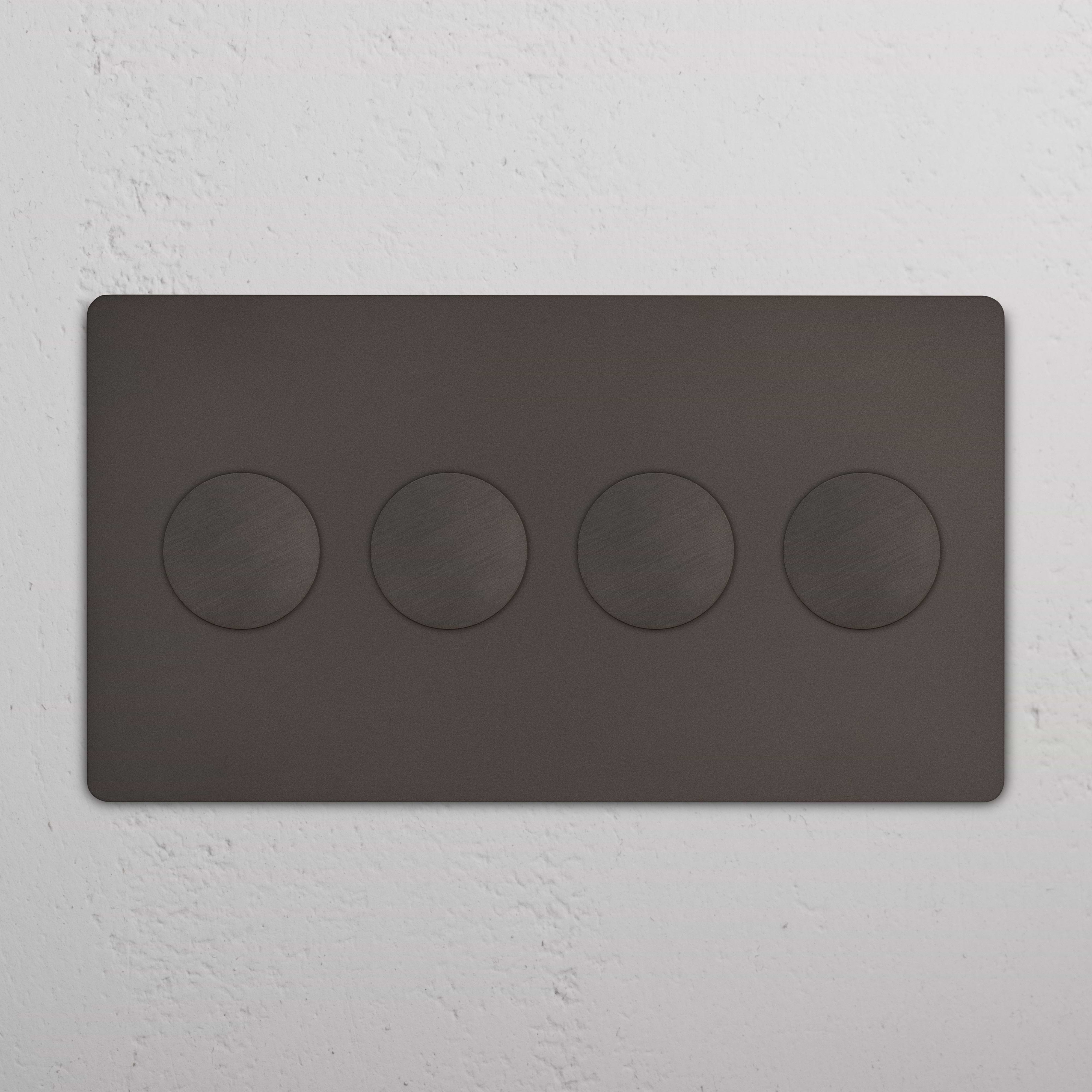 Bronze Grove 4G Dimmer Switch panel with four round push buttons, mounted on a white wall.
