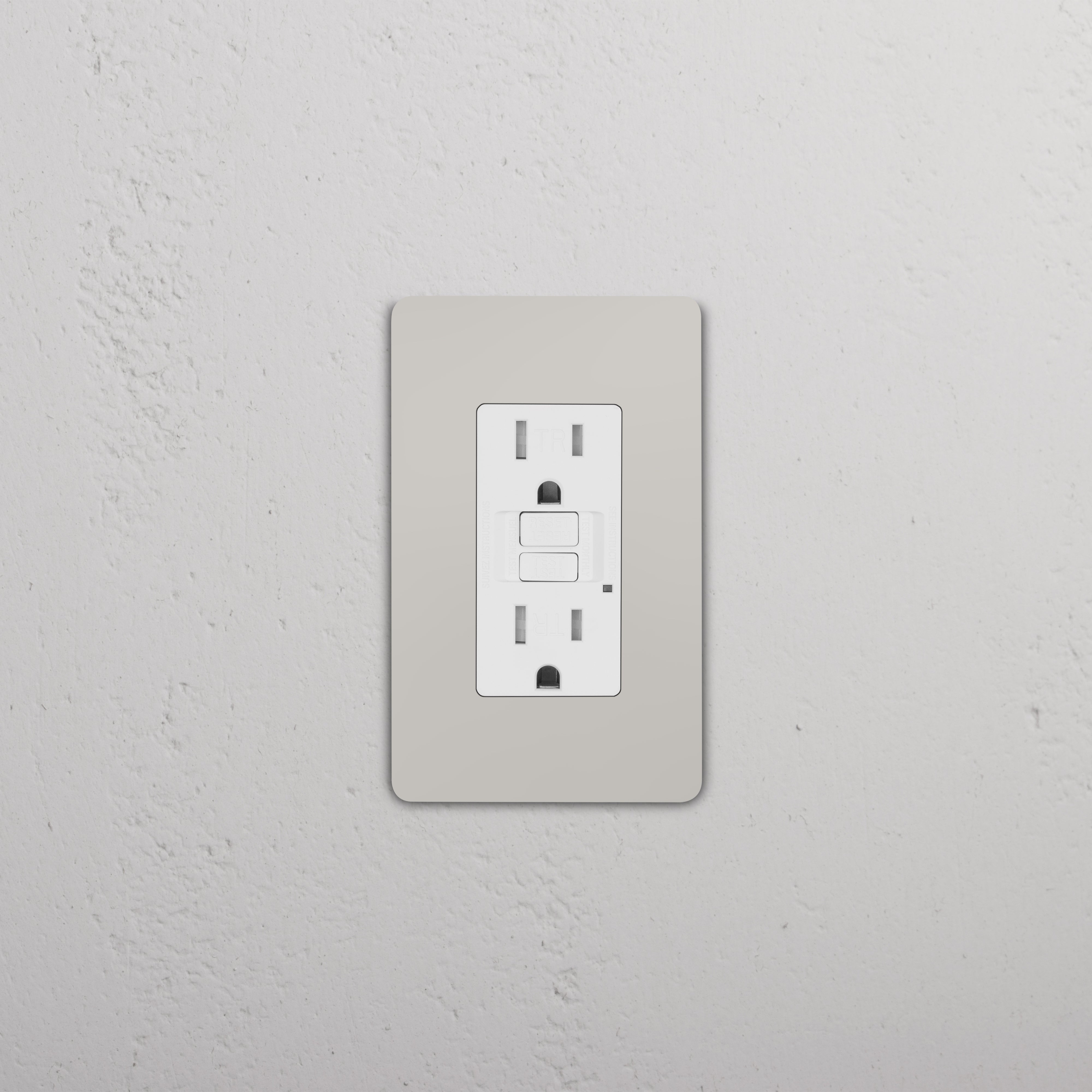 Grove 1G 15A GFCI Outlet in polished nickel white with reset and test buttons, installed on a wall.