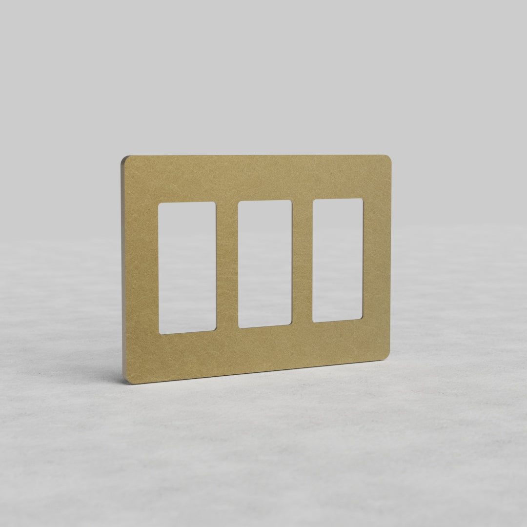 3G Outlet Plate Grove US in antique brass with three vertical rectangular openings, shown on a light background.