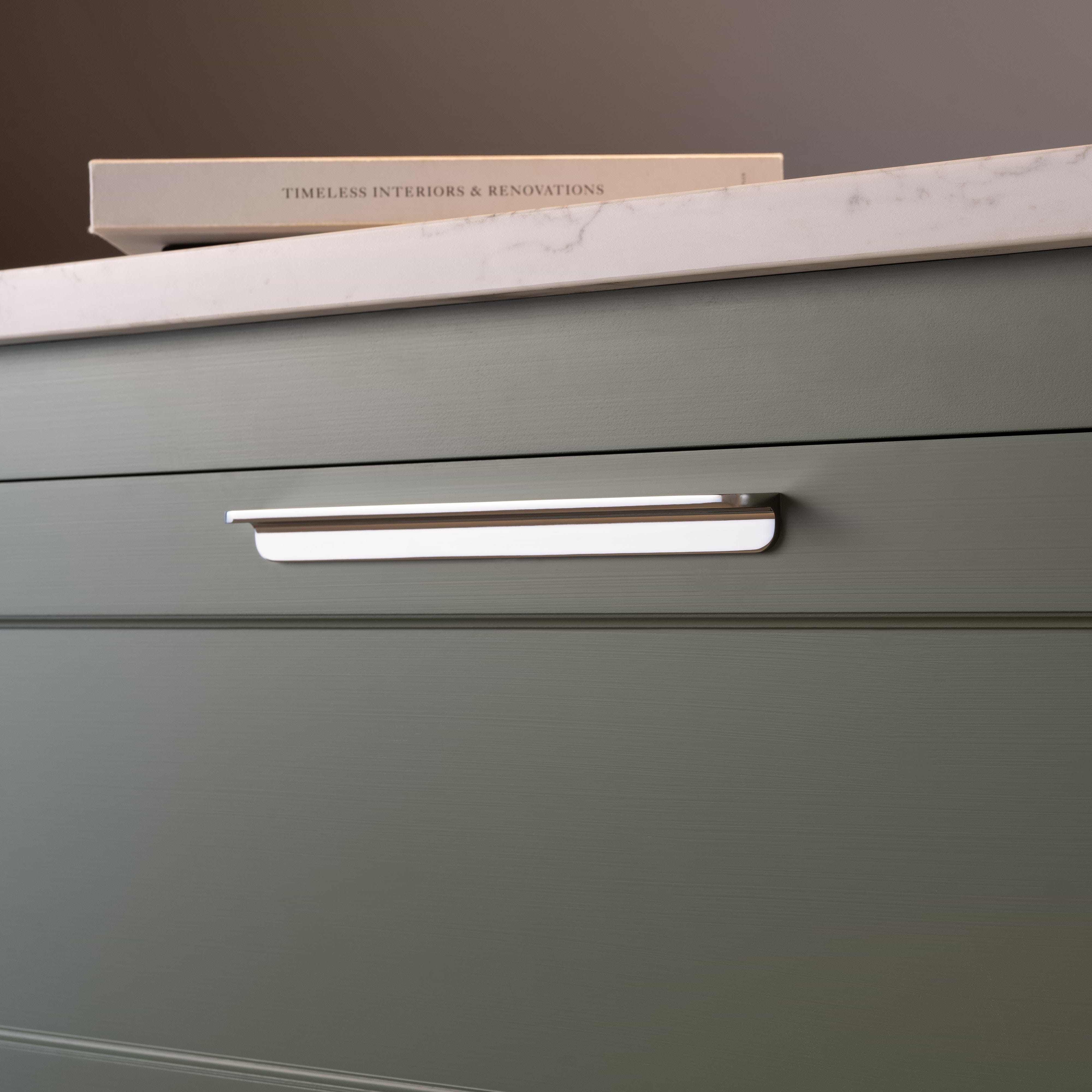 Large polished nickel Oxford Furniture Handle fitted on a matte green drawer beneath a white marble countertop.