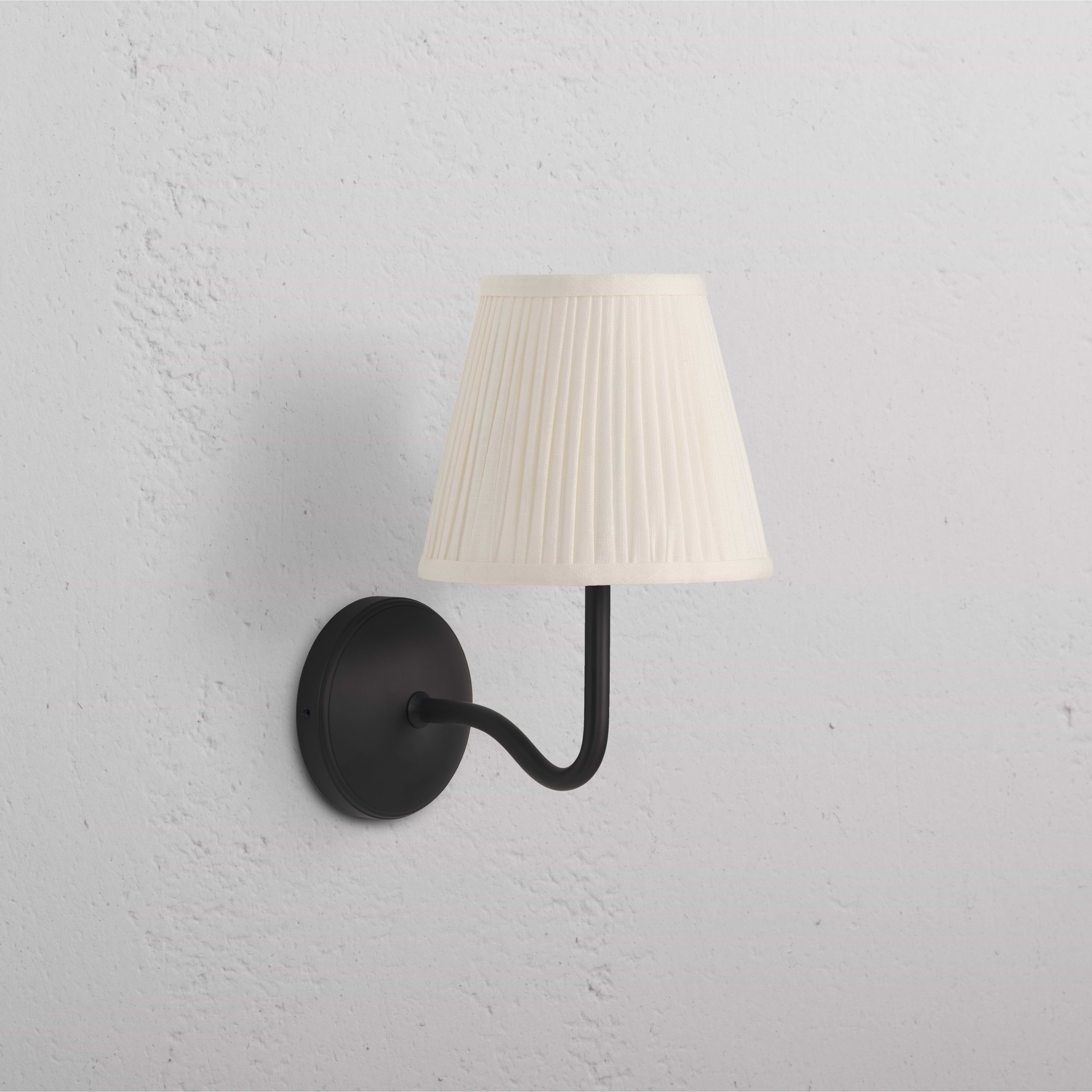 Malvern Medium Wall Light Alabaster White - Bronze with curved bronze arm and pleated alabaster white shade.