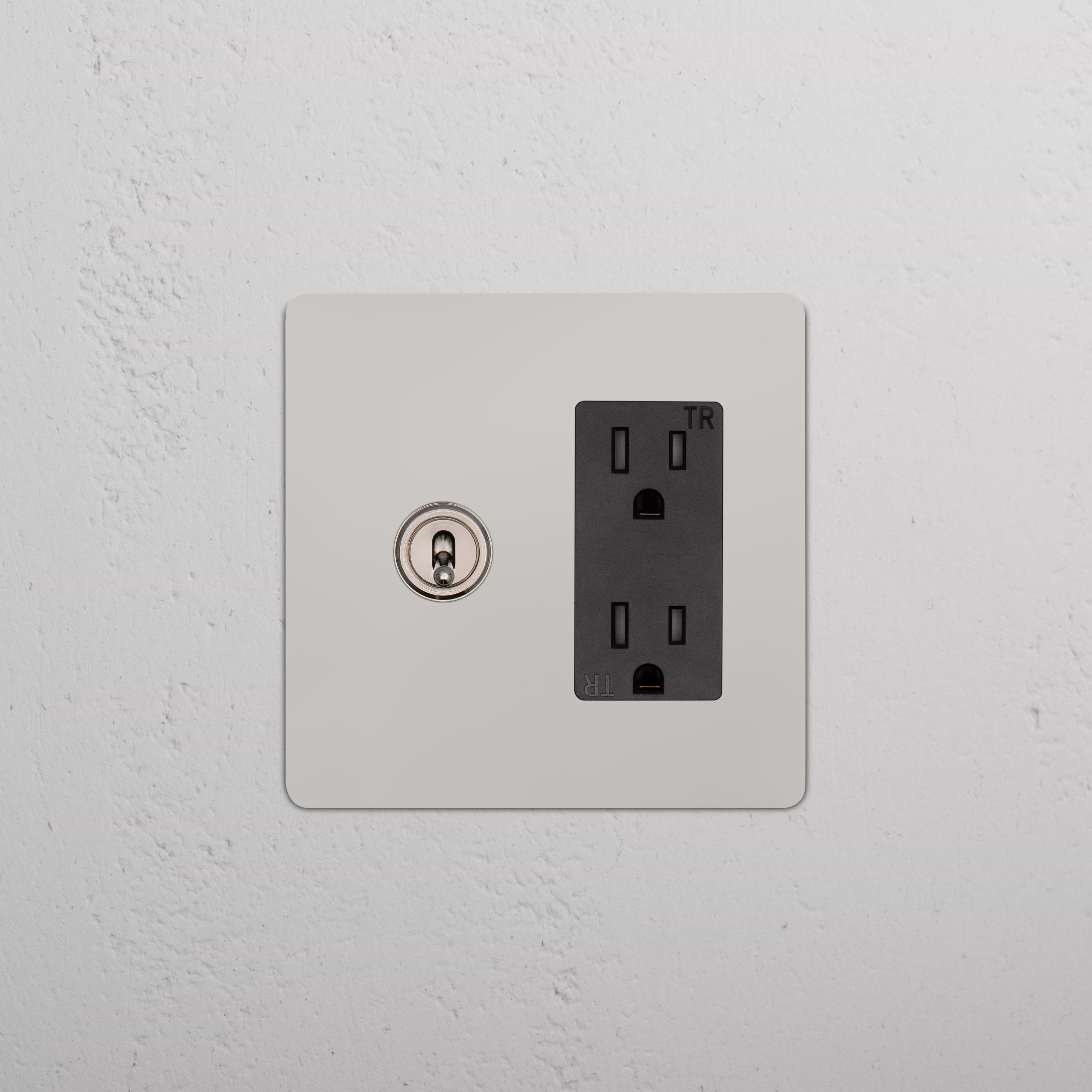 Kew 2G Toggle Switch & Outlet in polished nickel black finish, featuring two toggles and a black outlet.