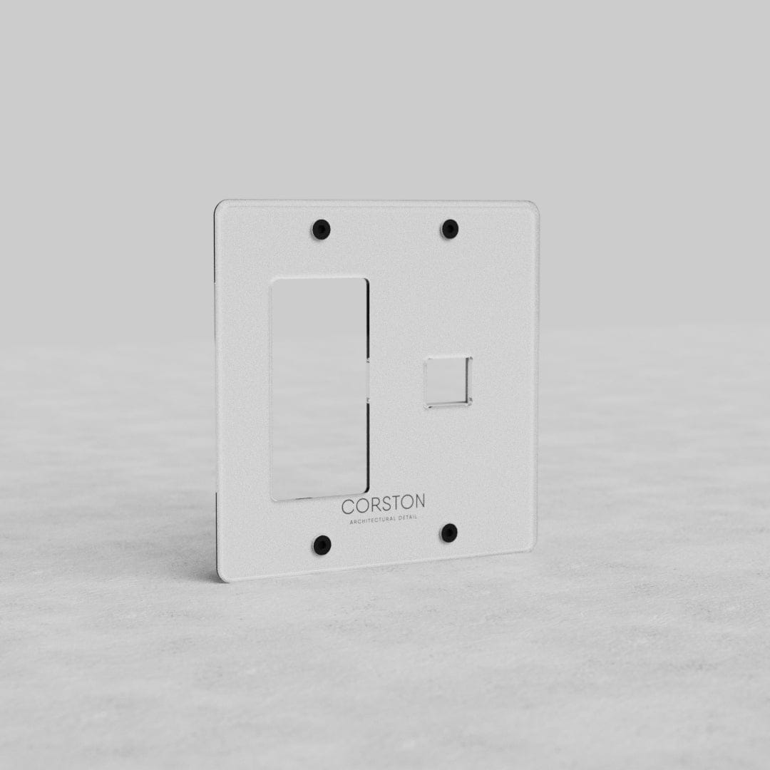 Clear 2G Outlet & Keystone Plate Kew US with one large and one small slot, 'CORSTON' branding at bottom.