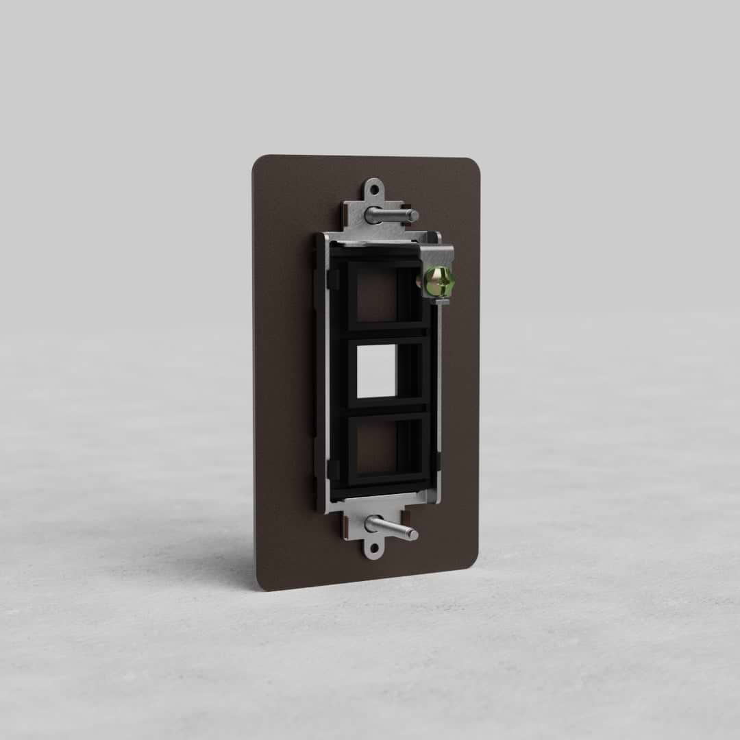 Bronze 1G Keystone Plate Kew US with two rectangular ports and metal mounting brackets on a plain background.