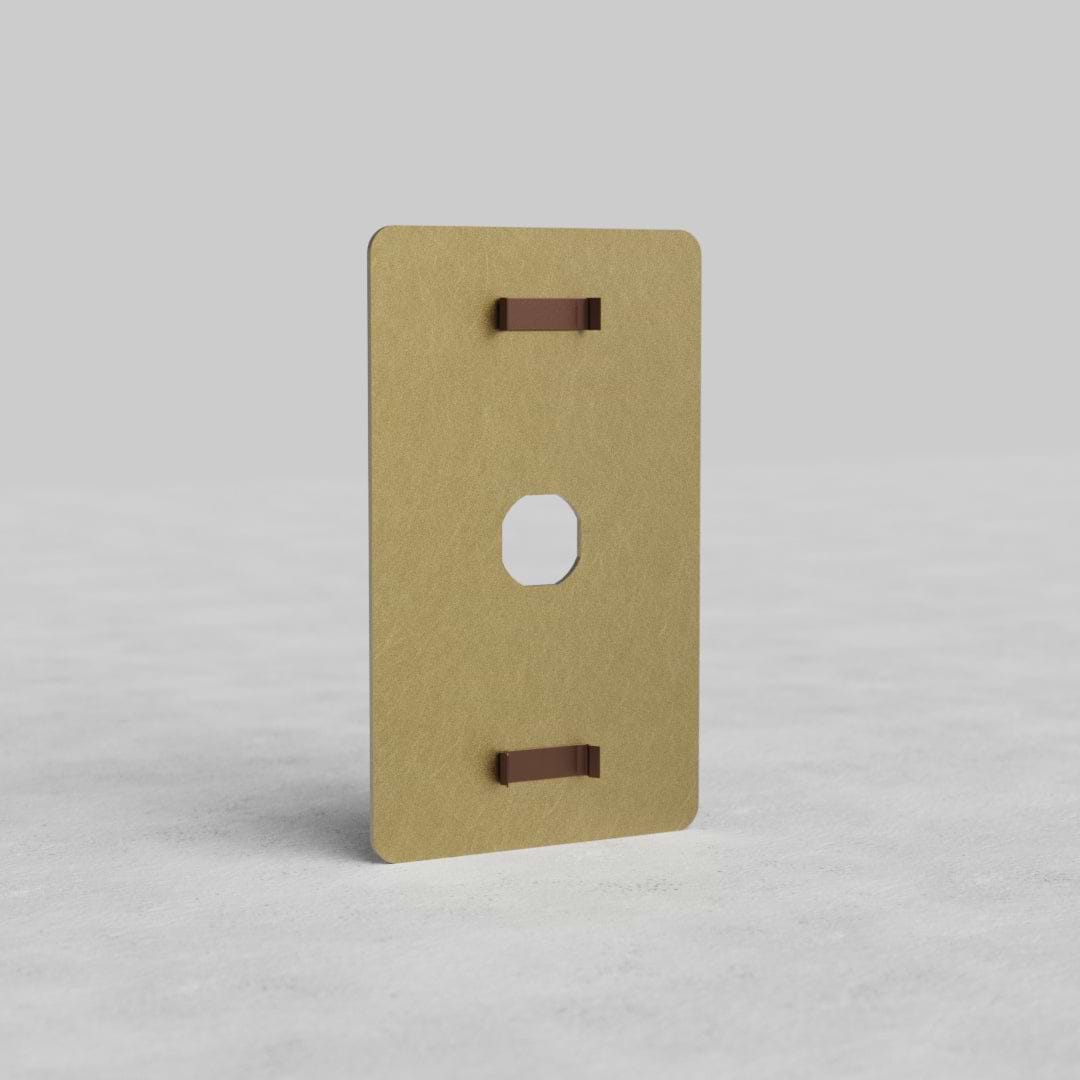1G Switch Plate Kew US in antique brass finish, rectangular with central toggle aperture, on light background.