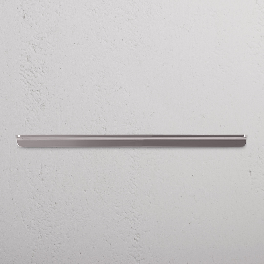 Large polished nickel Oxford Furniture Handle with a sleek design, mounted on a white surface.