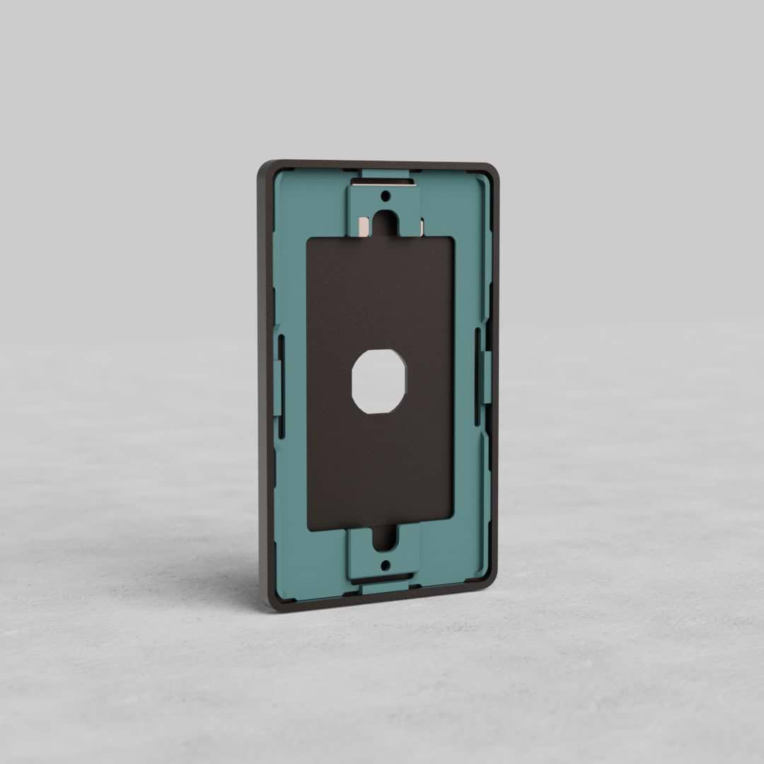 Bronze 1G Switch Plate Grove US with central rectangular cutout, displayed upright on a gray surface.