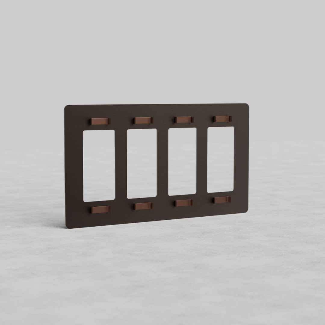 Bronze 4G Outlet Plate Kew US with four rectangular socket openings, shown standing on a light surface.