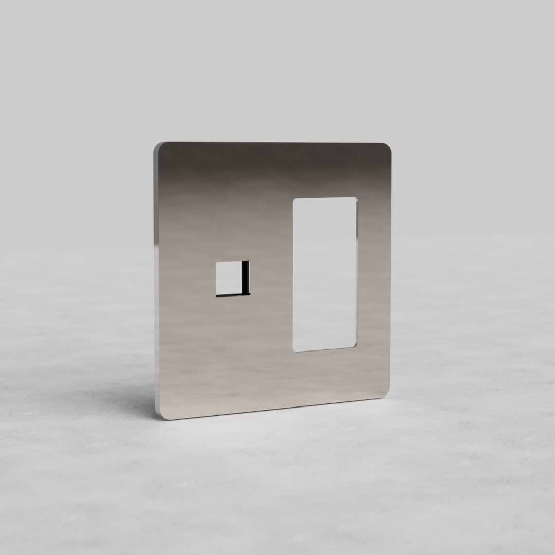 Polished Nickel 2G Outlet & Keystone Plate Grove US with two rectangular cutouts, shown on a gray surface.