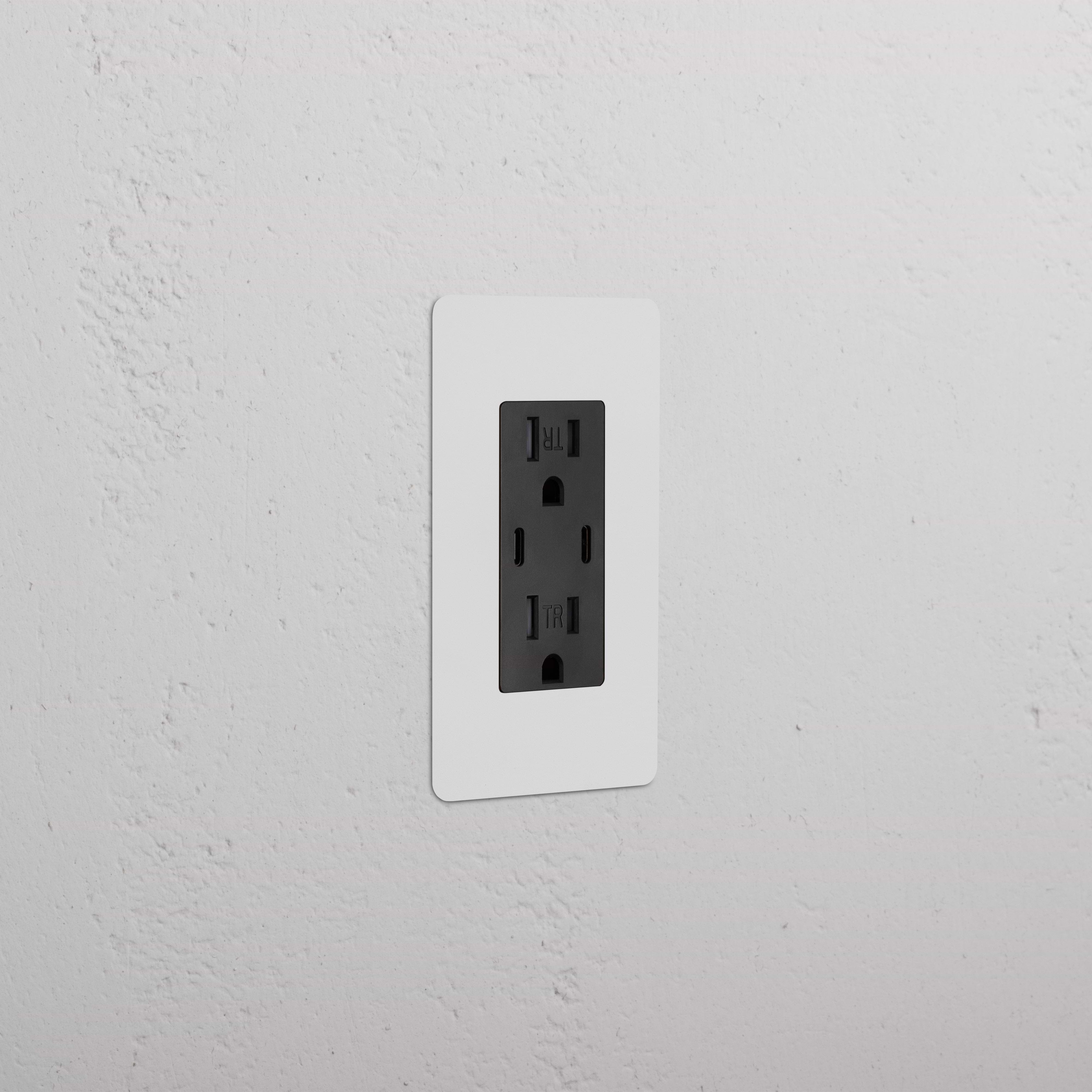 Kew 1G 15A USB Outlet in paintable black finish with two sockets, installed on a white wall plate.