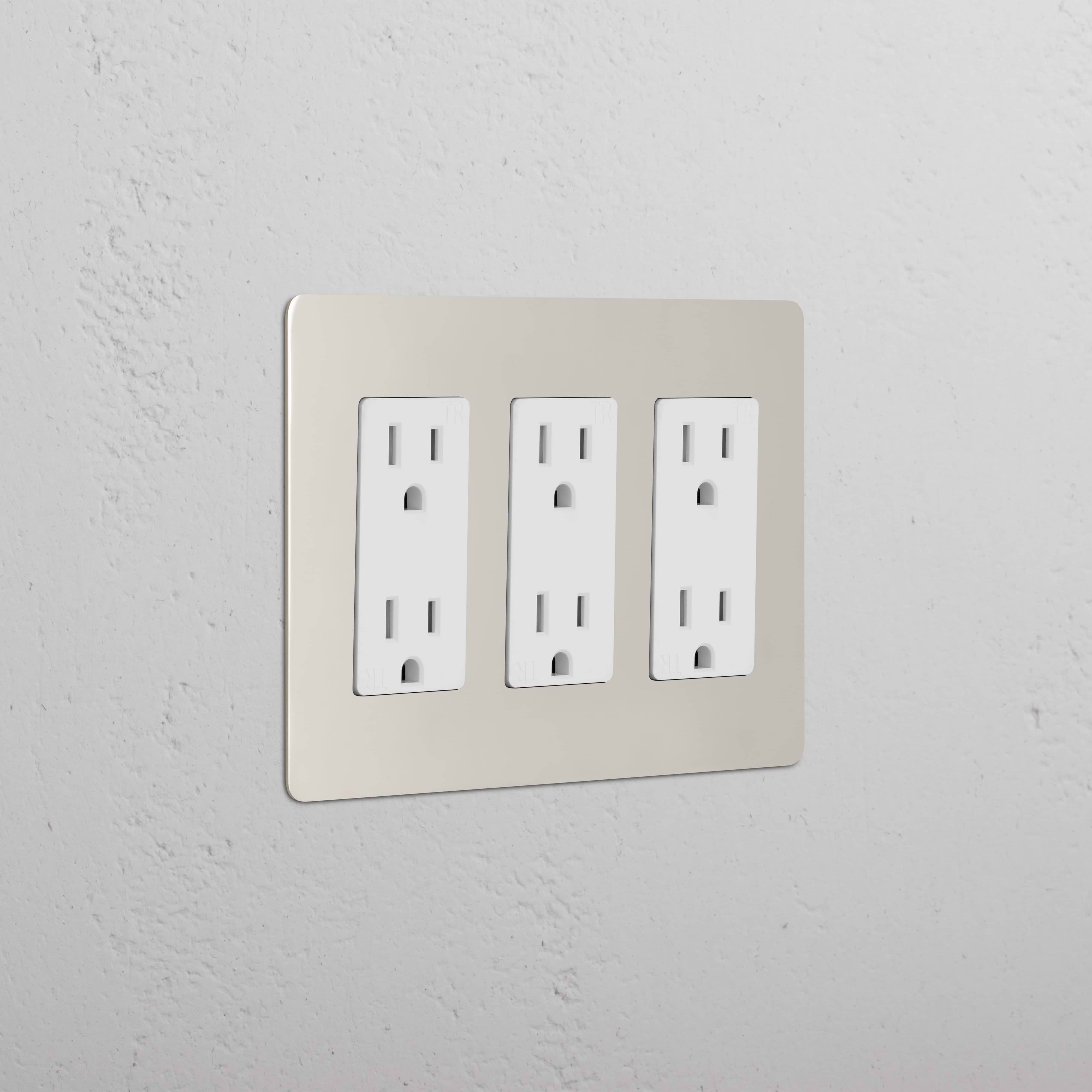 Kew 3G Outlet in polished nickel white finish, triple electrical socket plate on a light wall.