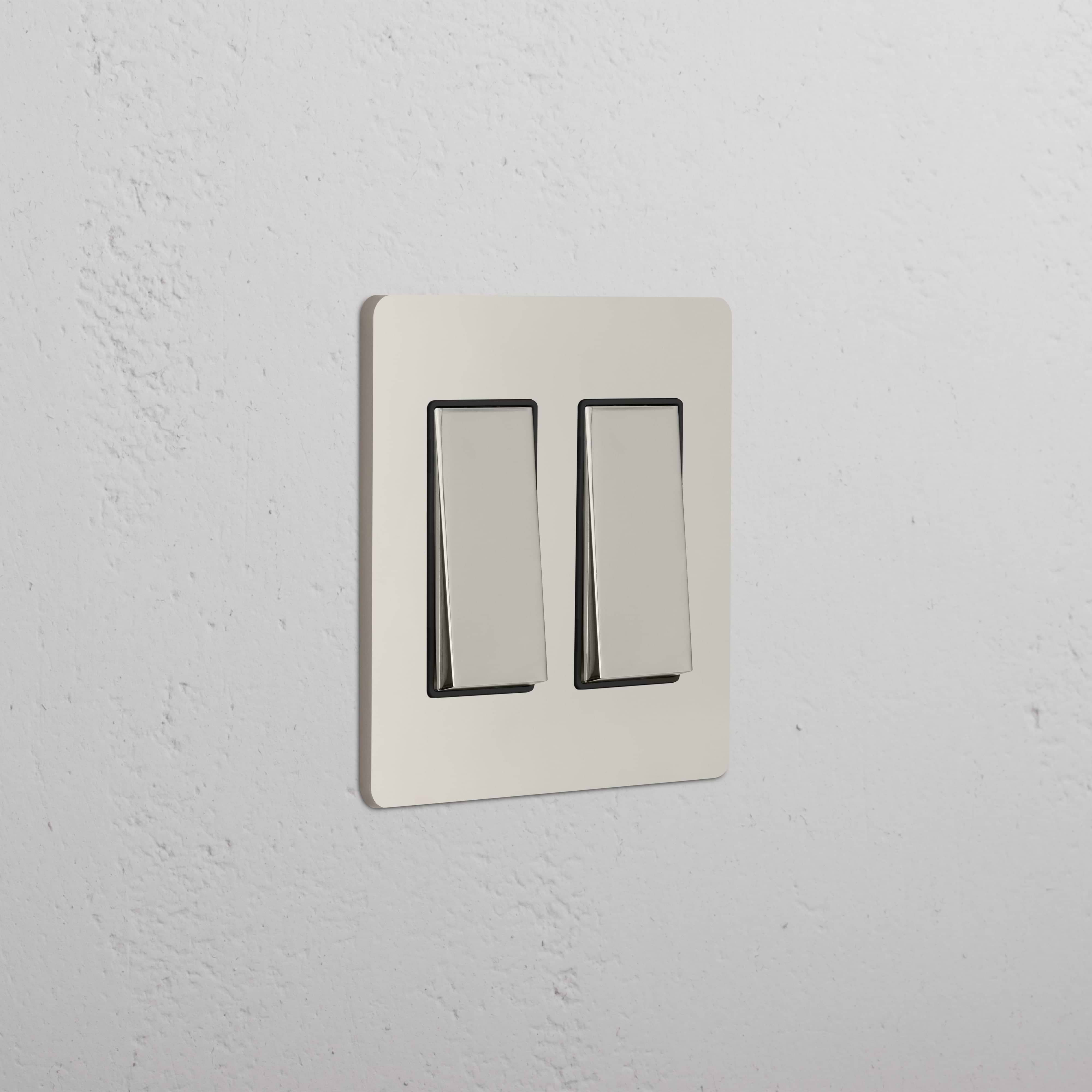 Grove 2G Rocker Switch in polished nickel black finish, featuring two rocker switches on a wall plate.