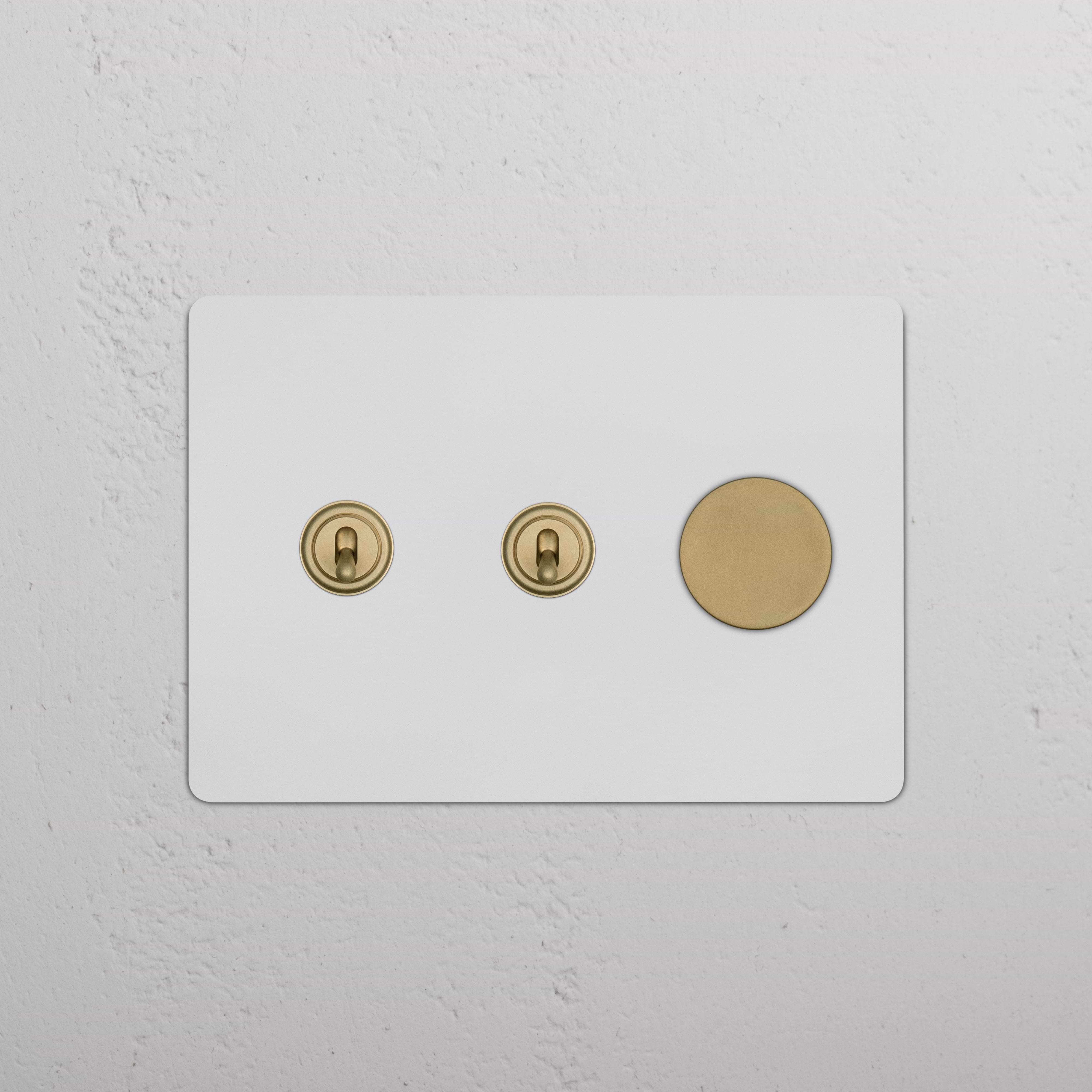 Kew 3G 2x Toggle & Dimmer Switch in paintable antique brass with two toggles and one dimmer button.