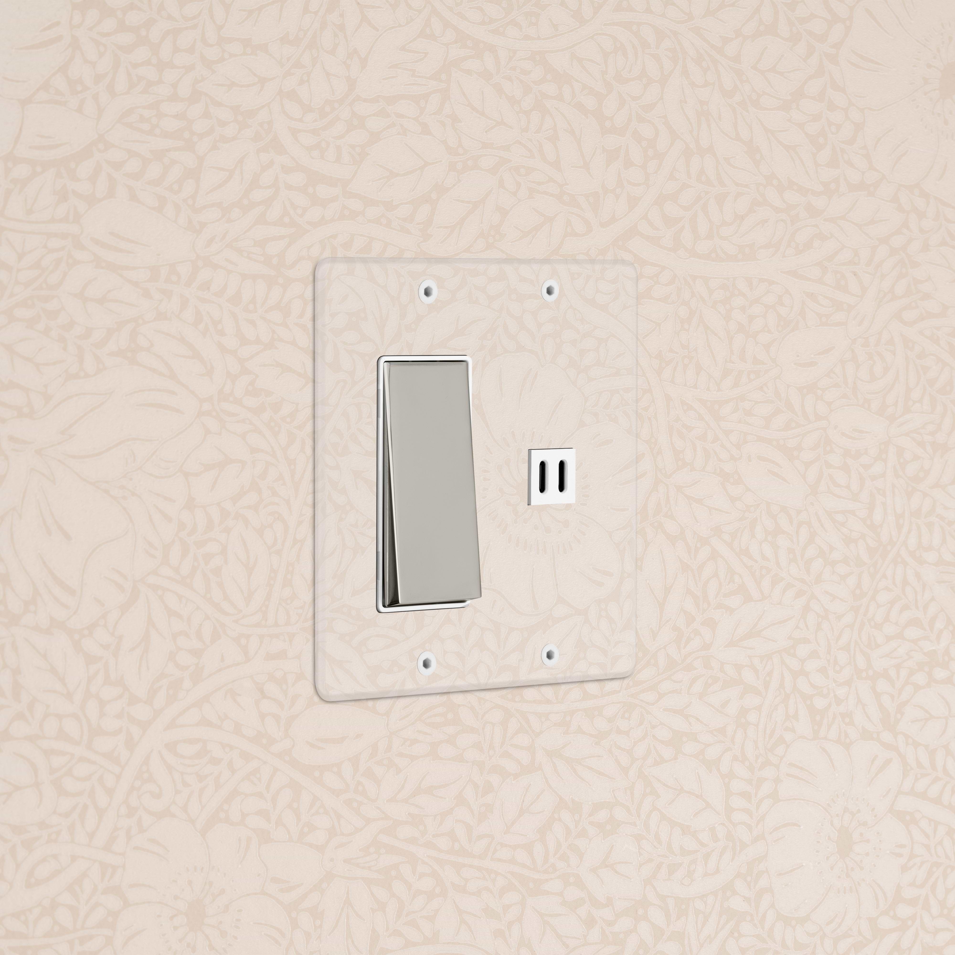 Kew 2G Rocker Switch & Fast Charge USB in clear polished nickel and white, mounted on a floral wall.