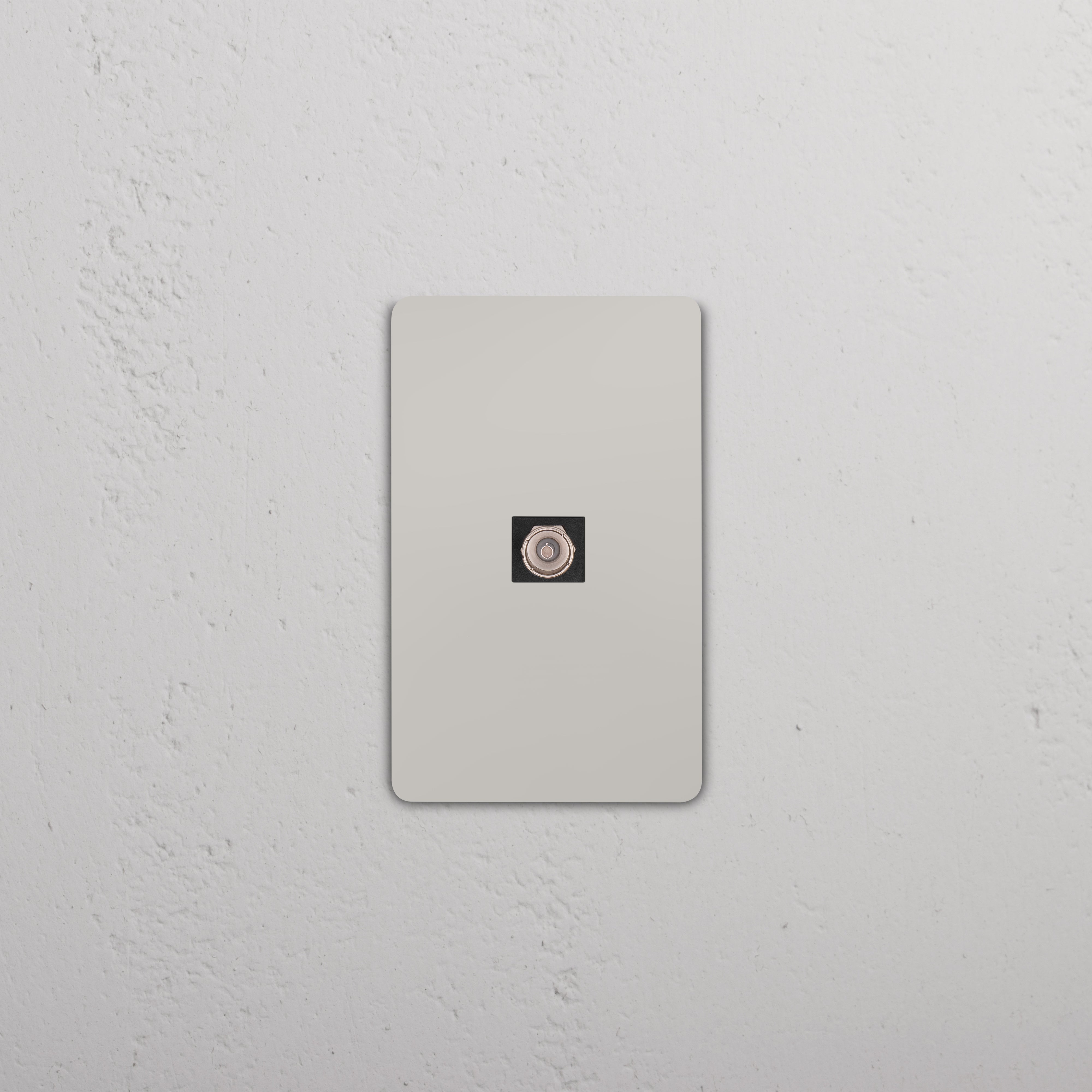 Grove 1G TV Keystone in Polished Nickel Black finish, shown mounted on a white wall plate.