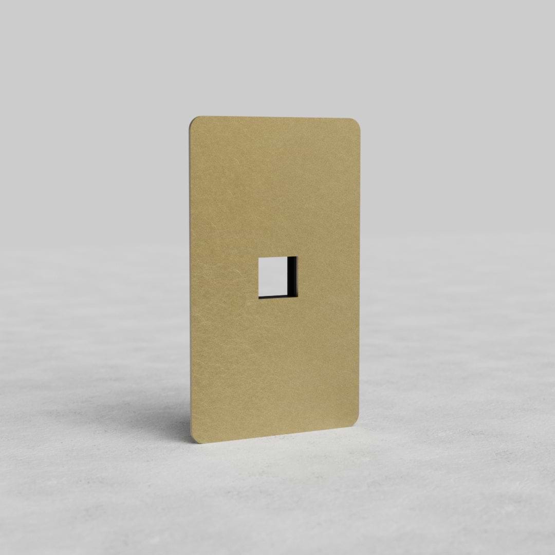 Antique brass 1G Keystone Plate Kew US with single keystone cutout and rounded corners on light background.