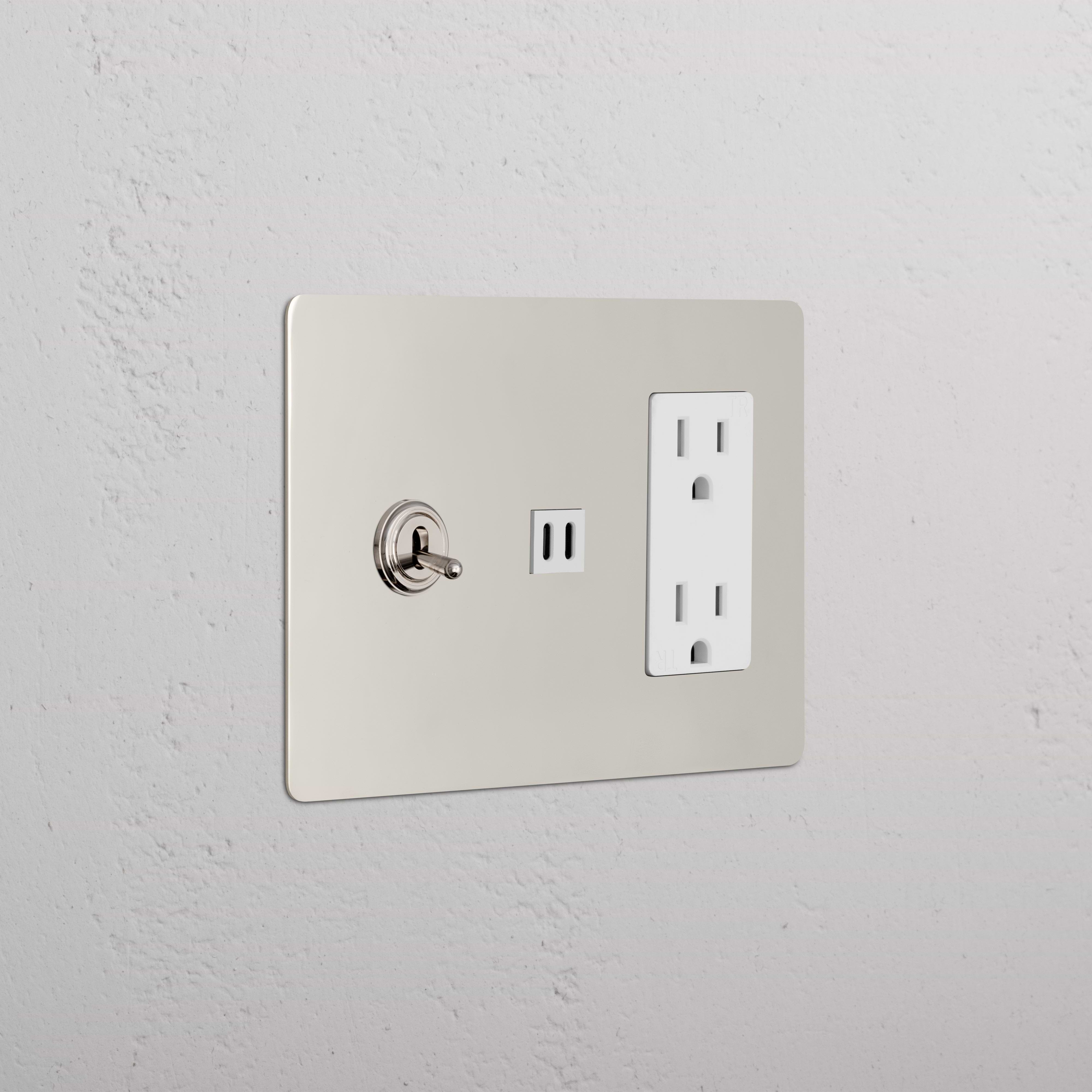 Kew 3G Toggle Switch & Outlet with Fast Charge USB in Polished Nickel White, mounted on a white wall.