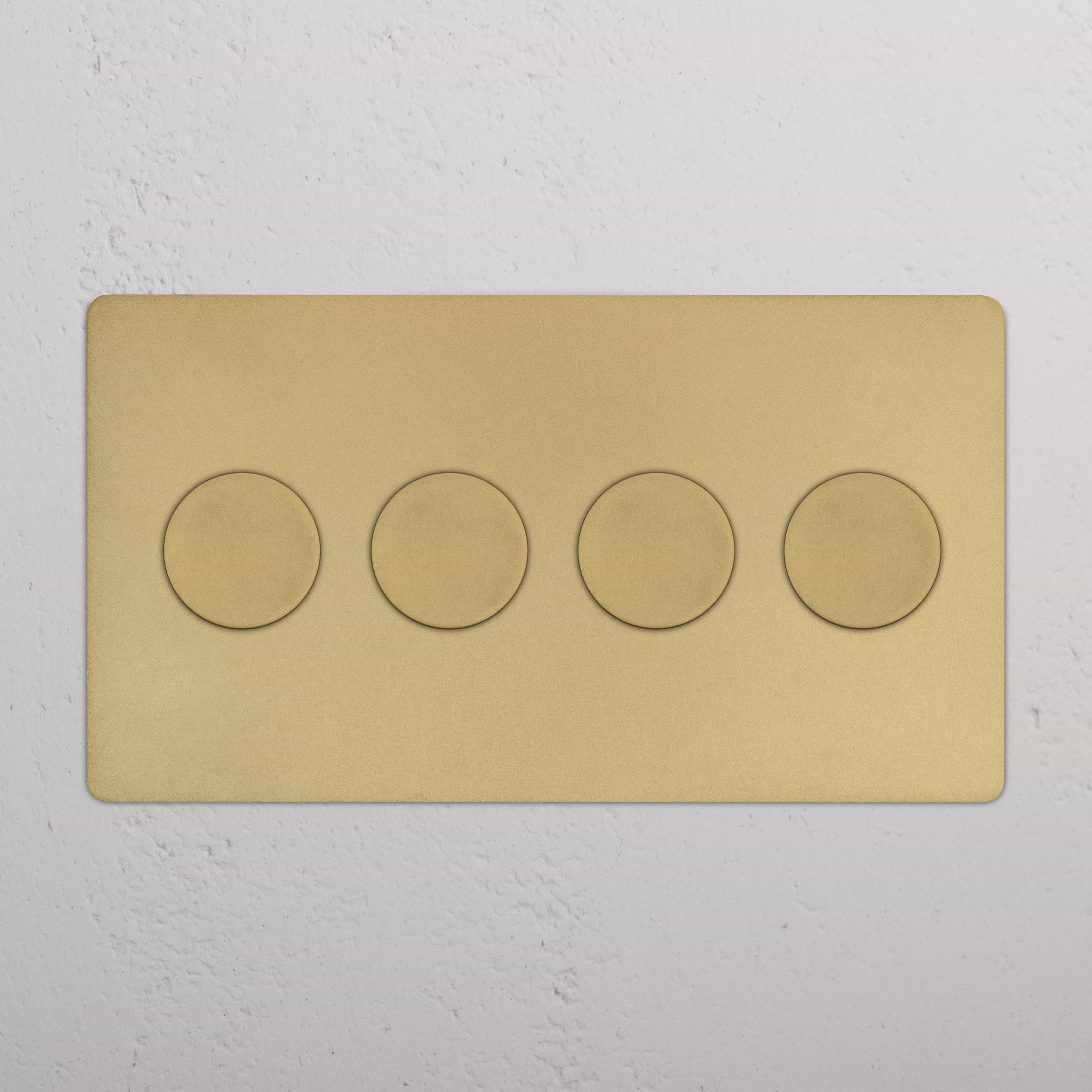 Kew 4G Dimmer Switch in antique brass with four circular dials on a gold-colored rectangular panel.