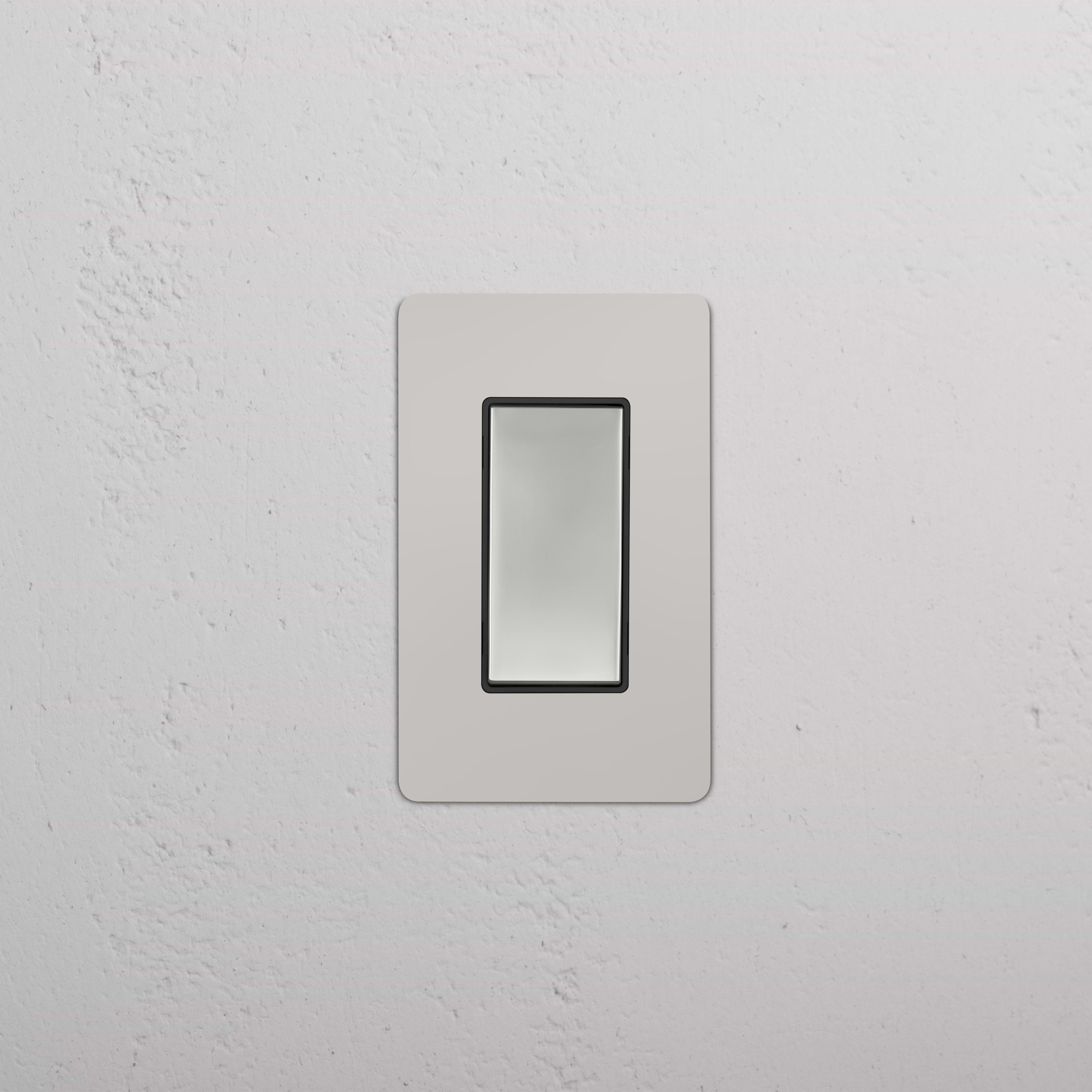 Kew 1G Smart Retractive Rocker Switch in polished nickel black finish, shown mounted on a wall.