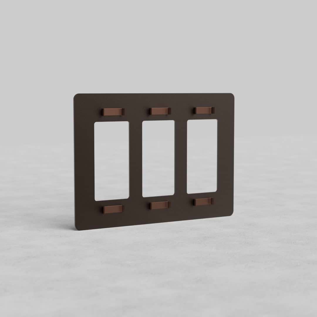 Bronze 3G outlet plate Kew US featuring three vertical rectangular slots, displayed on a light surface.