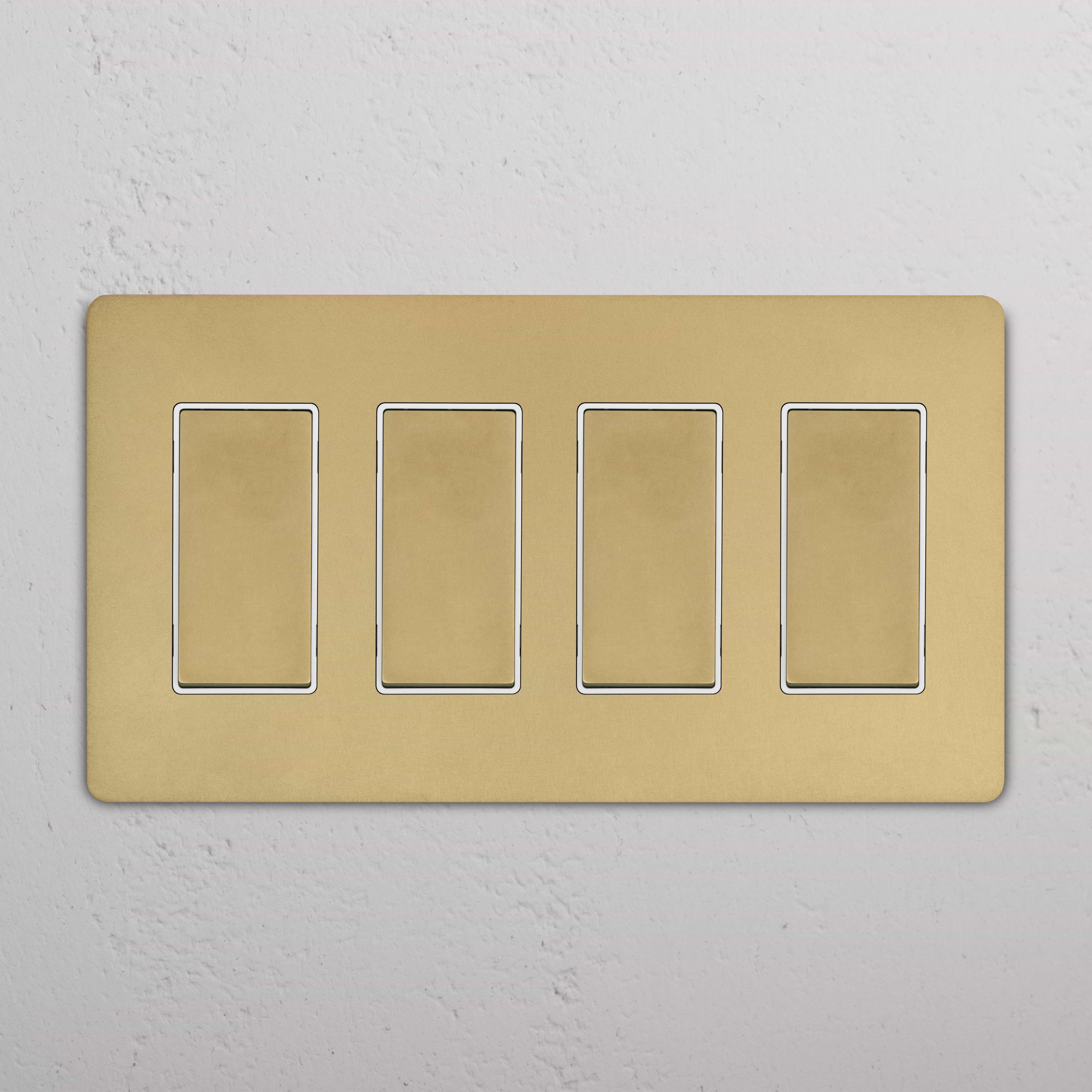 Grove 4G Rocker Switch in antique brass white finish with four rectangular switches on a single panel.