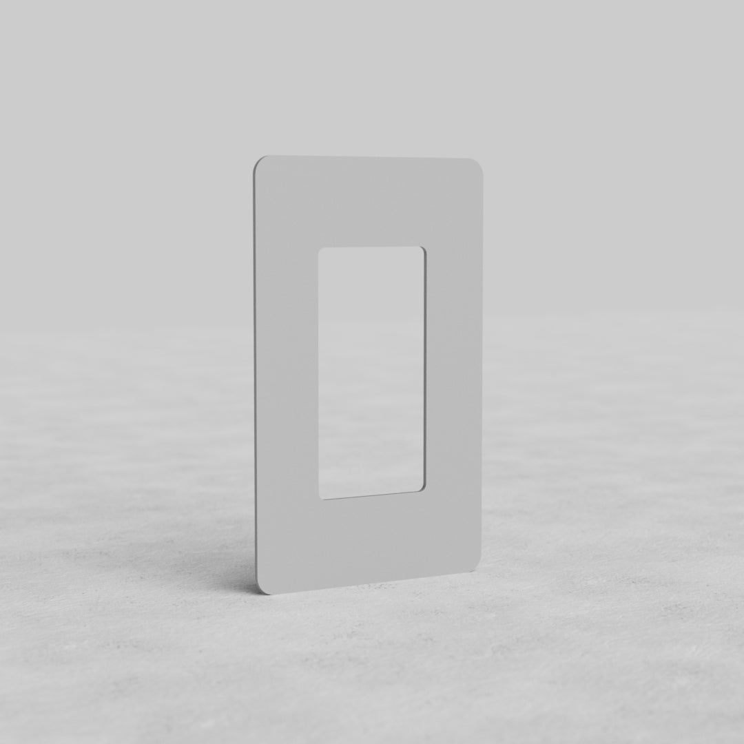 Rectangular 1G Outlet Plate Kew US, paintable cover plate, shown upright on a light gray surface.