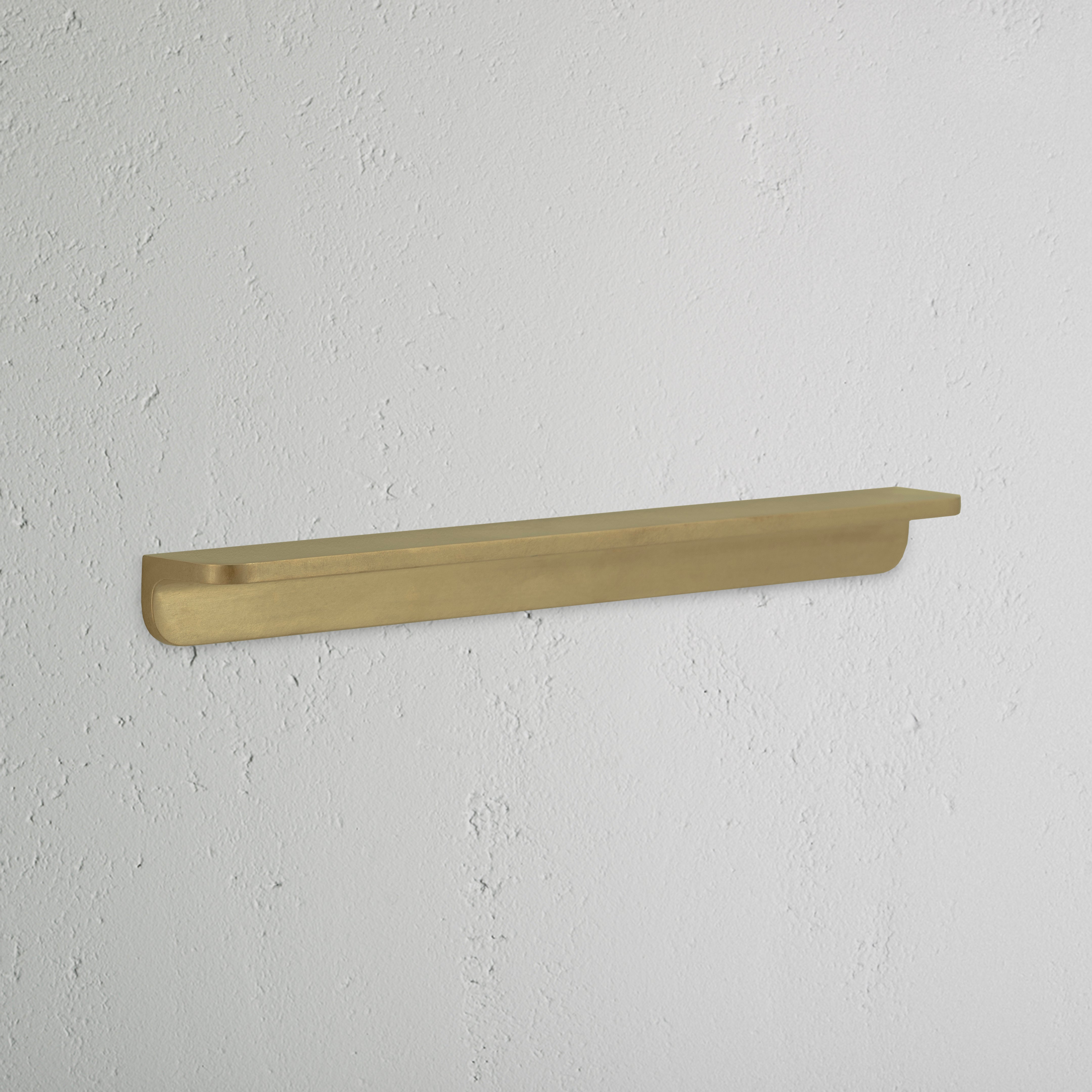 Medium antique brass Oxford furniture handle with a smooth, rounded design, shown against a white background.