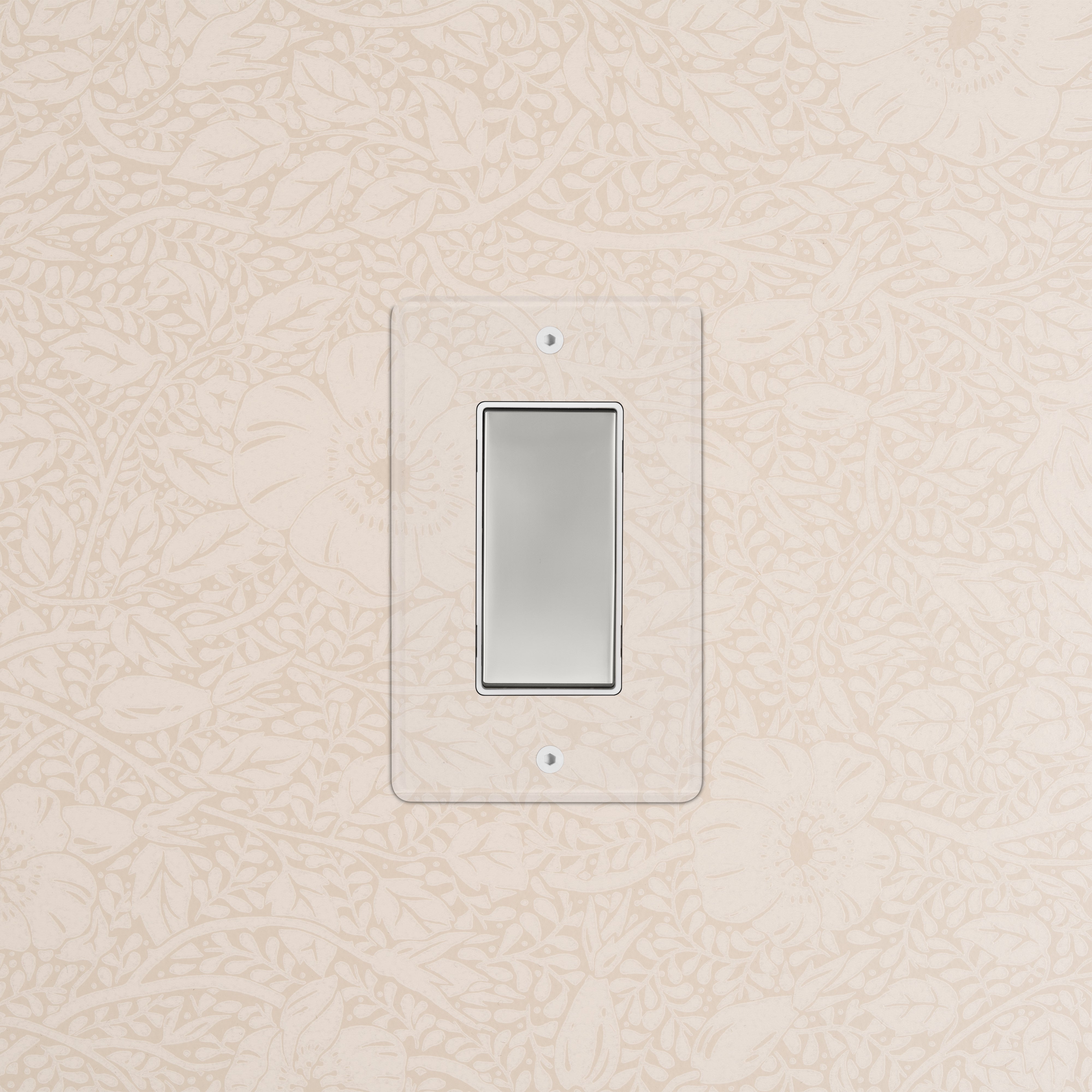 Kew 1G Rocker Switch with clear polished nickel and white cover plate, mounted on a wall.