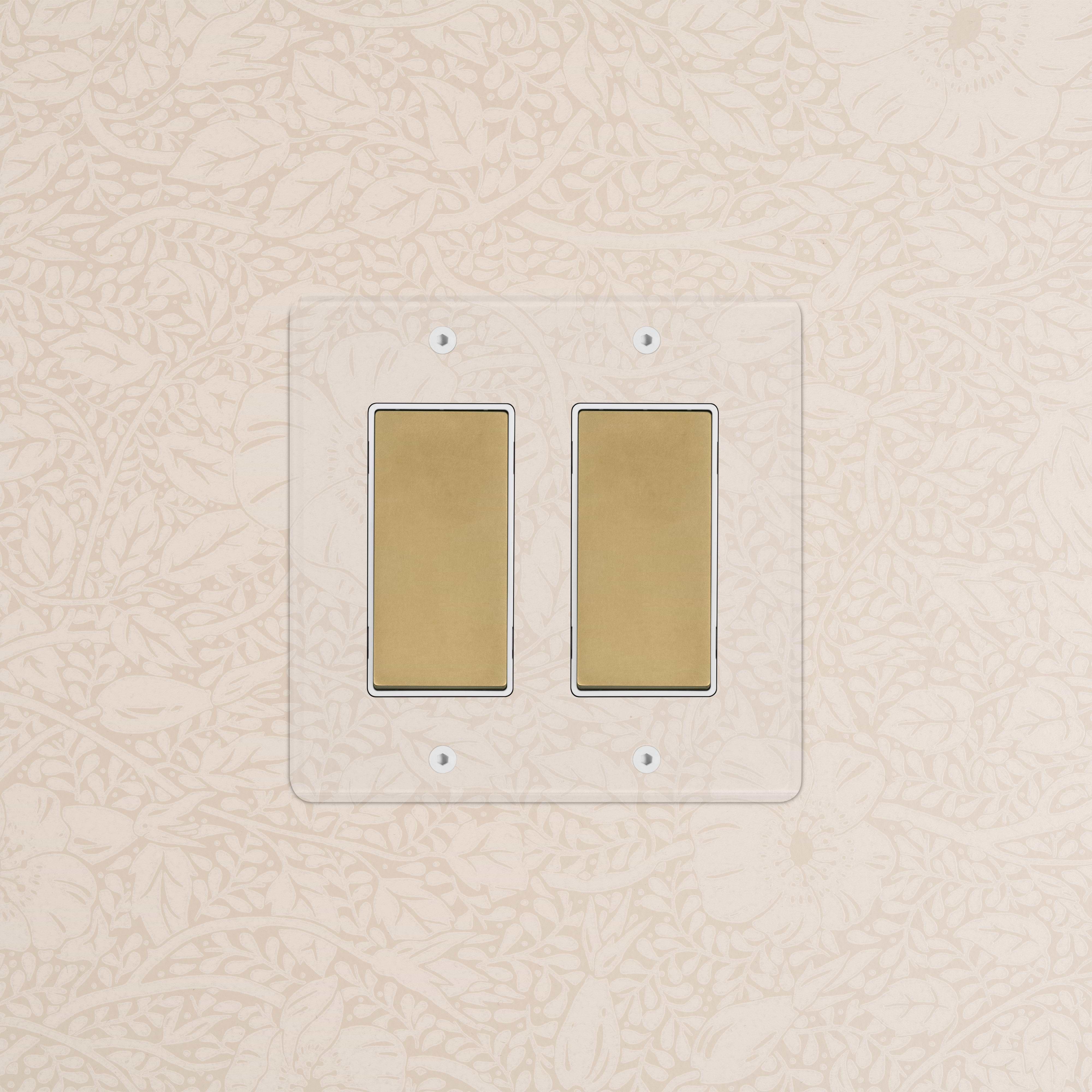 Kew 2G Rocker Switch in clear antique brass white finish, featuring two rectangular rocker switches.