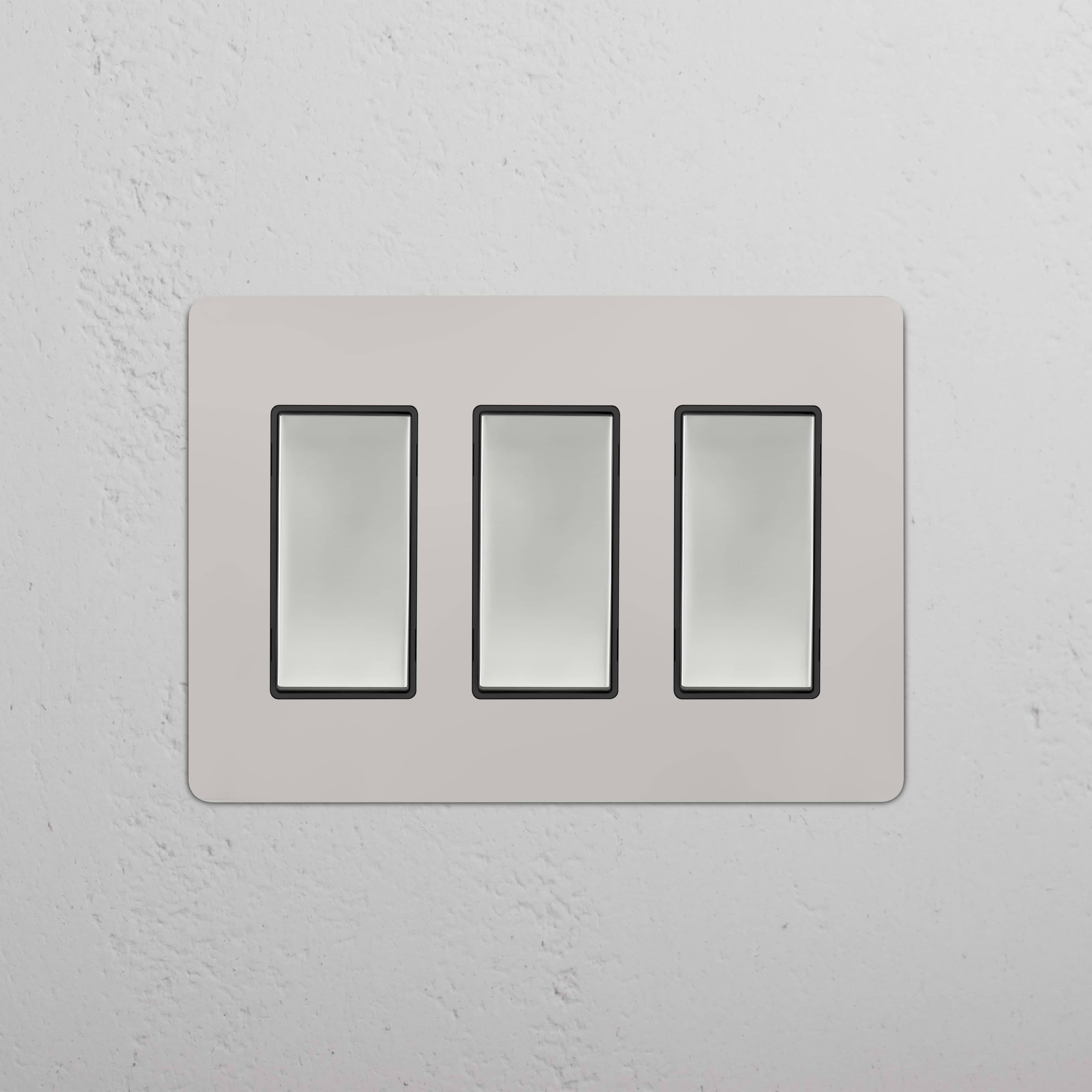 Kew 3G Rocker Switch in Polished Nickel Black with three rectangular switches on a sleek wall plate.