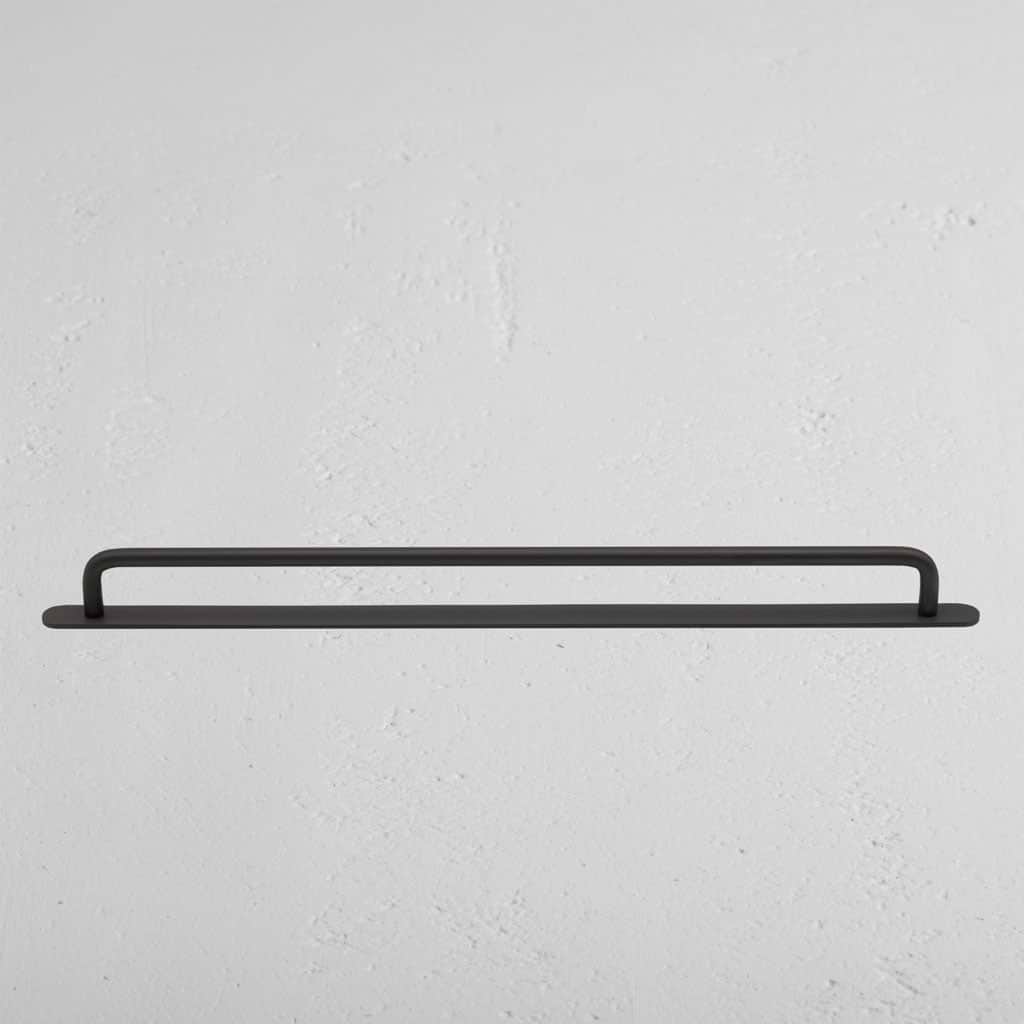 Large bronze Kilburn furniture handle with a sleek, minimalist design, shown against a neutral background.