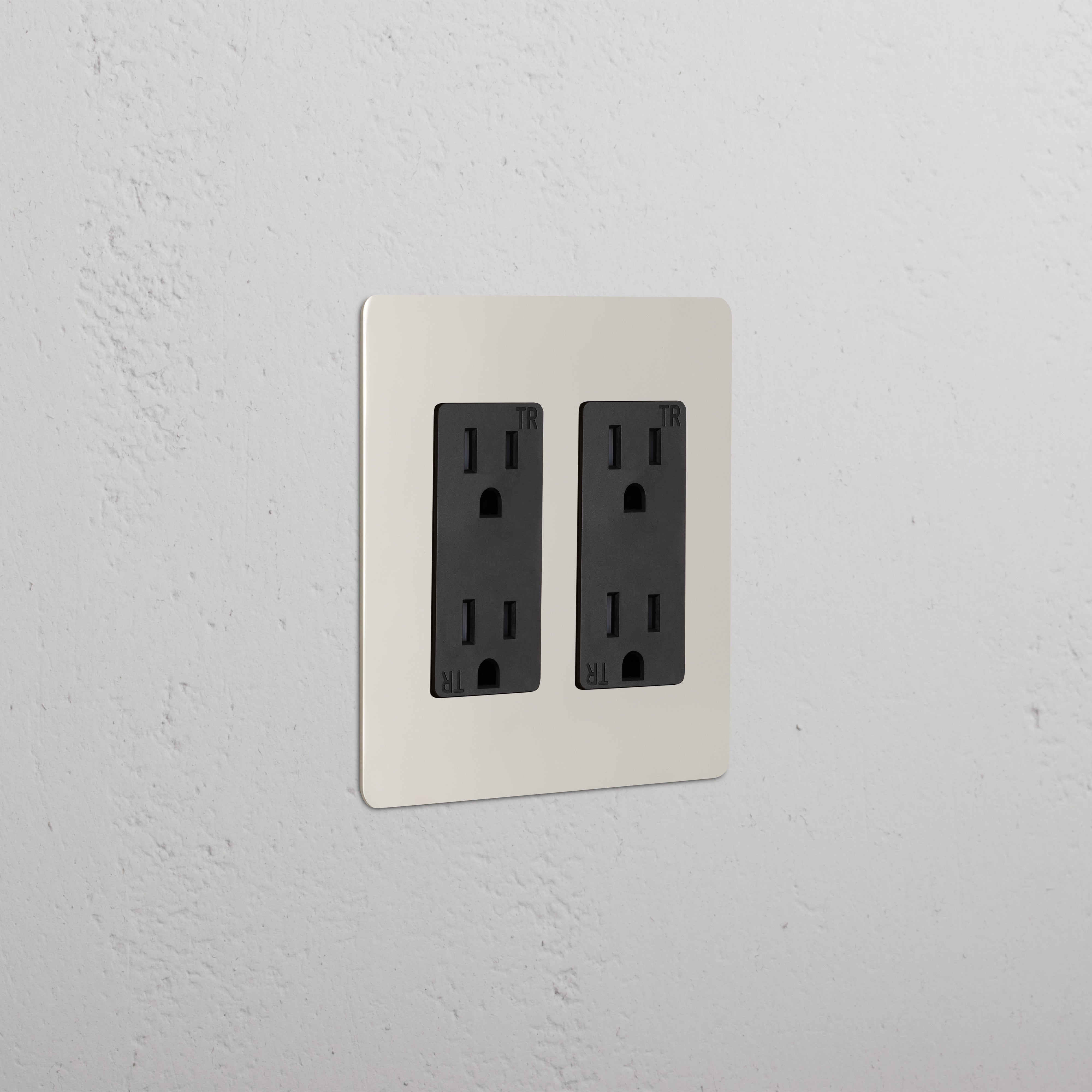 Kew 2G Outlet in polished nickel black finish with two black tamper-resistant three-prong sockets.