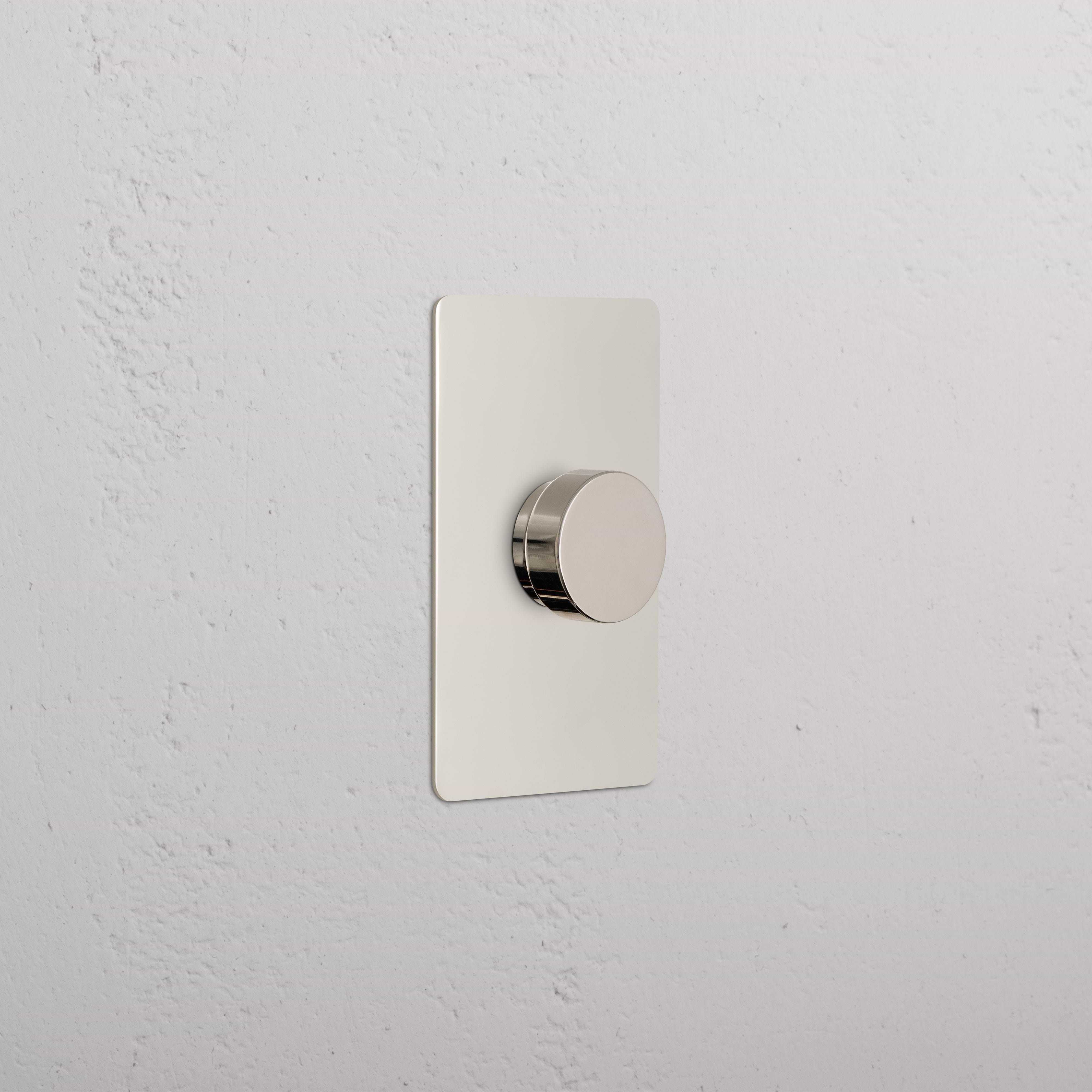 Kew 1G Dimmer Switch in polished nickel with a round knob on a rectangular plate, wall-mounted.
