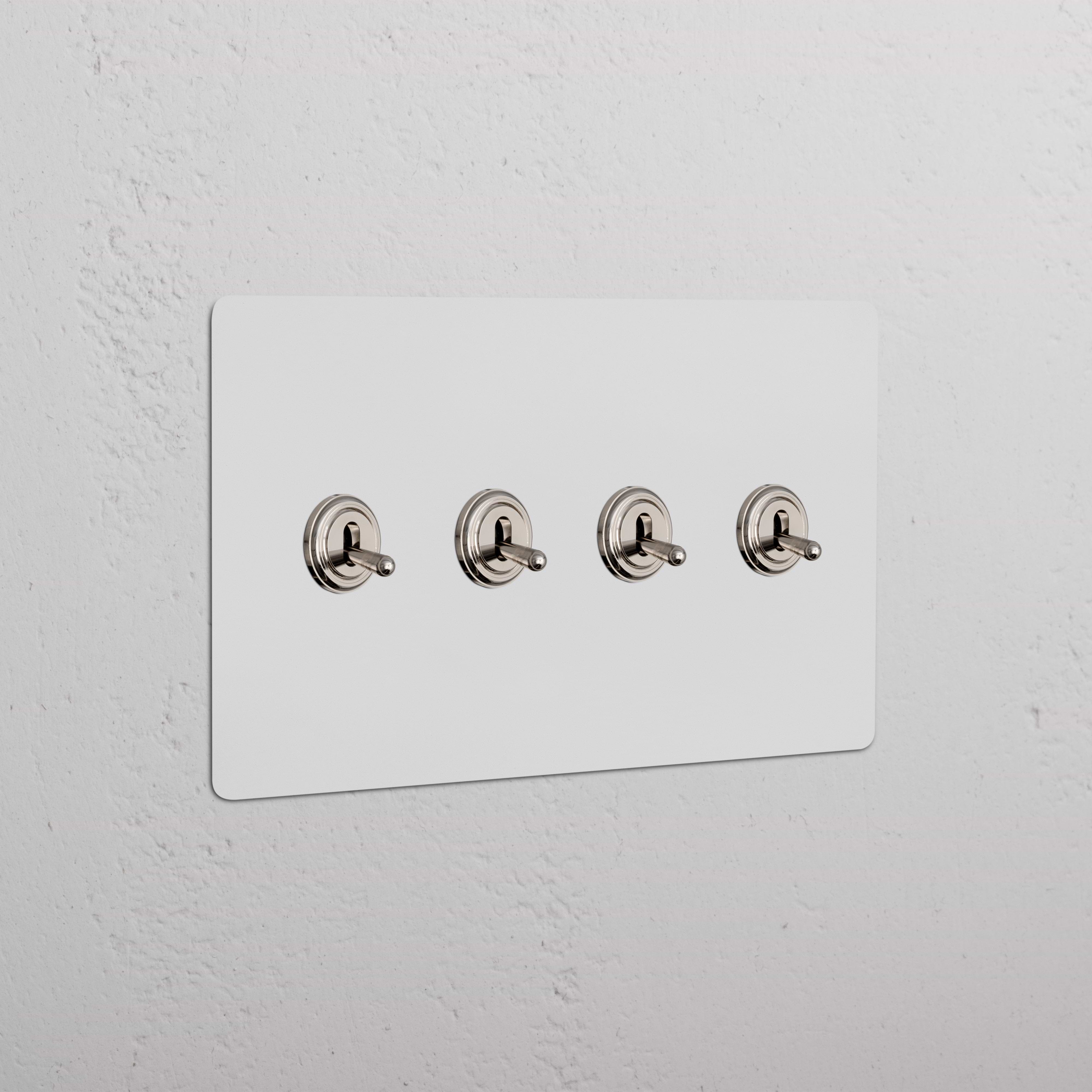 Kew 4G Toggle Switch in paintable polished nickel finish, four toggle switches on a rectangular plate.
