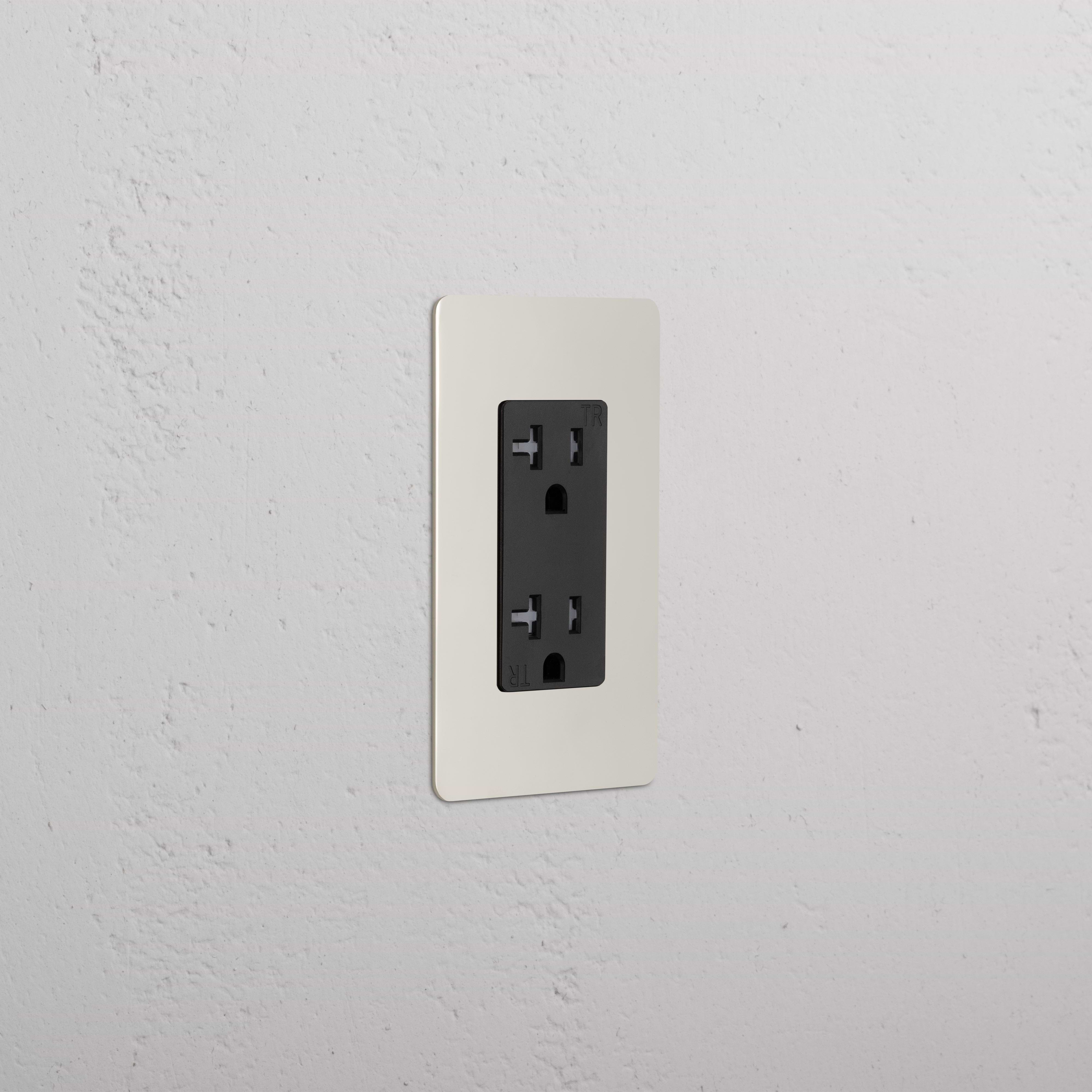Kew 1G 20A Outlet with polished nickel black faceplate, installed on a white textured wall.