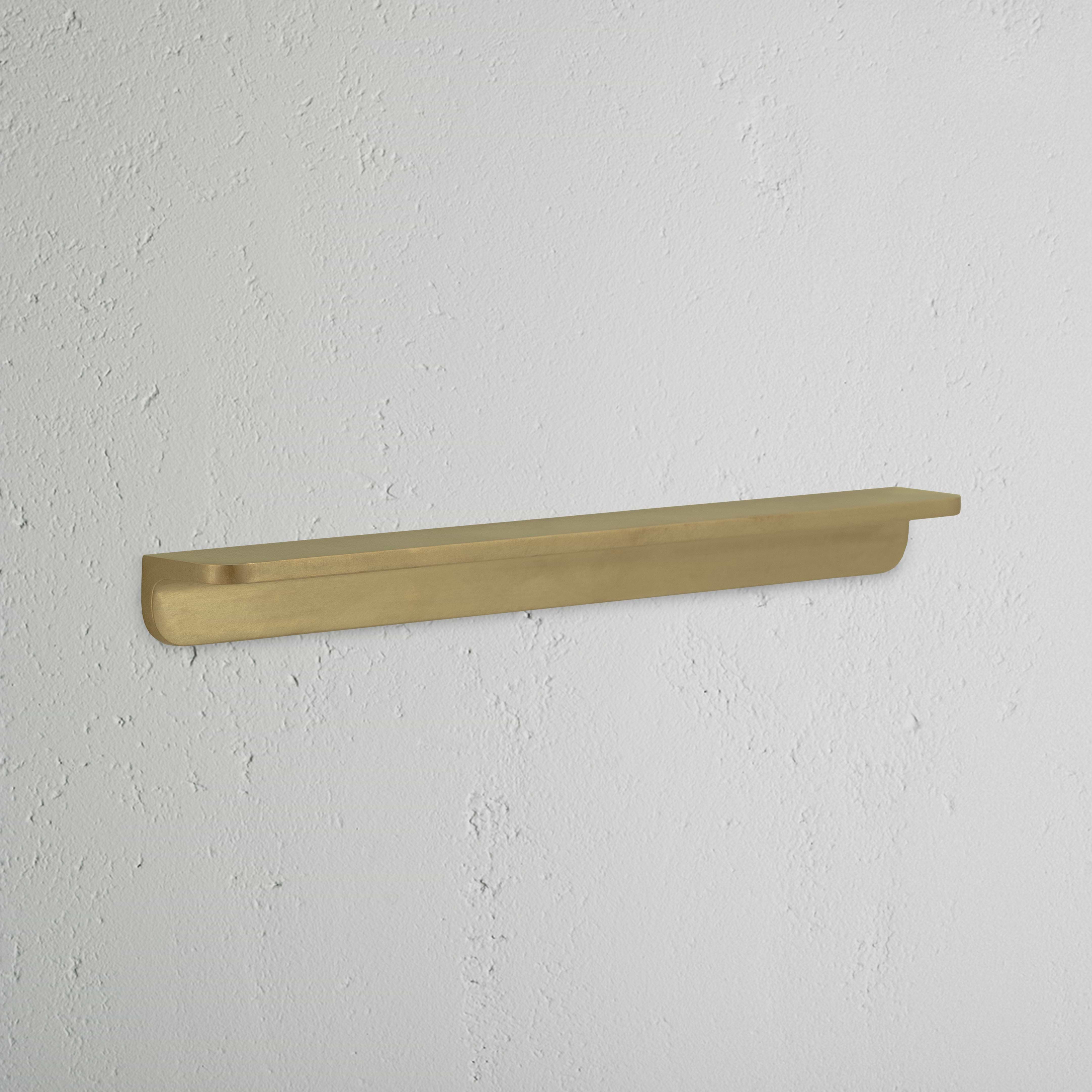 Medium antique brass Oxford furniture handle with a smooth, rounded design, shown against a white background.