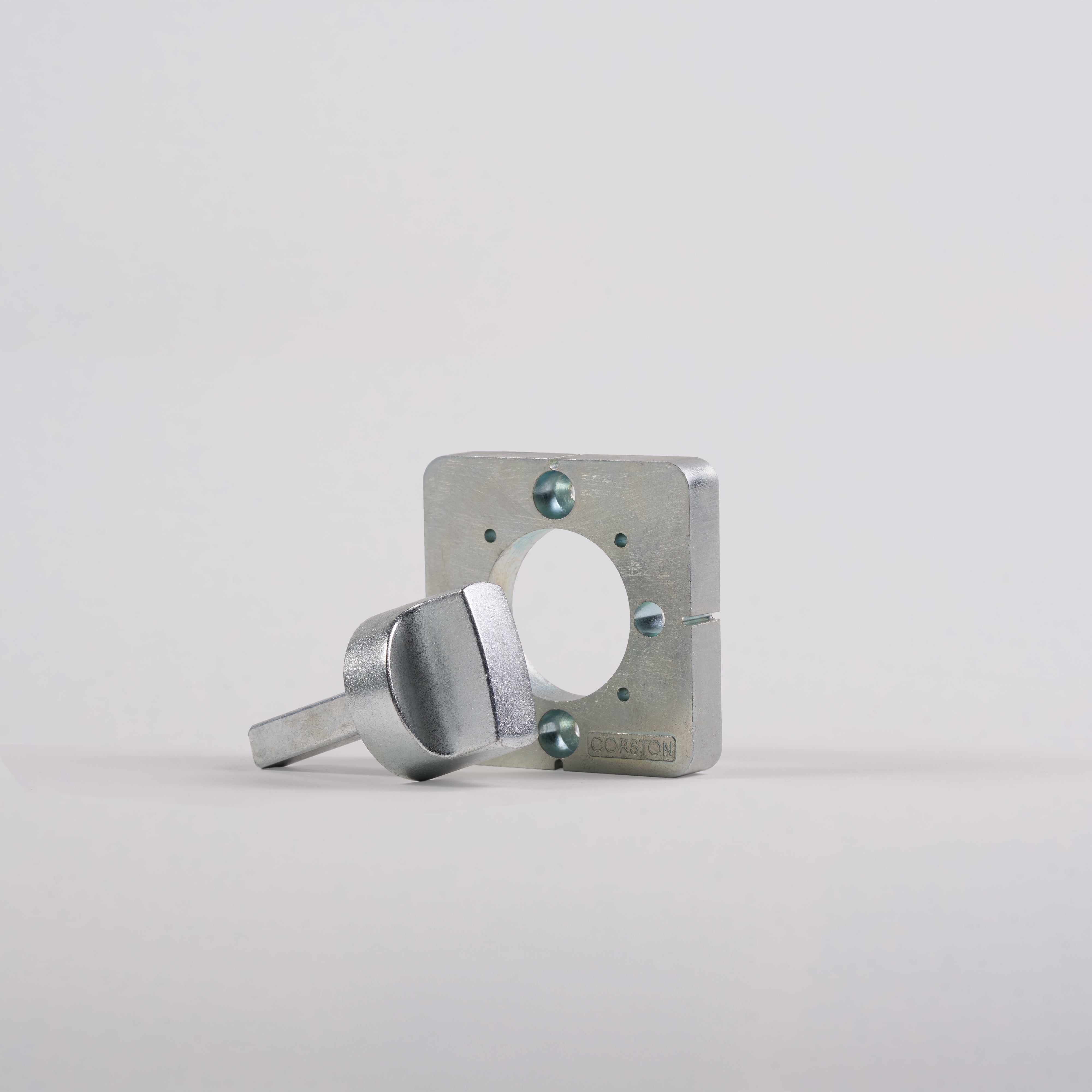 Door Handle Installation Tool with a square metal plate, circular hole, lever handle, and three screws.