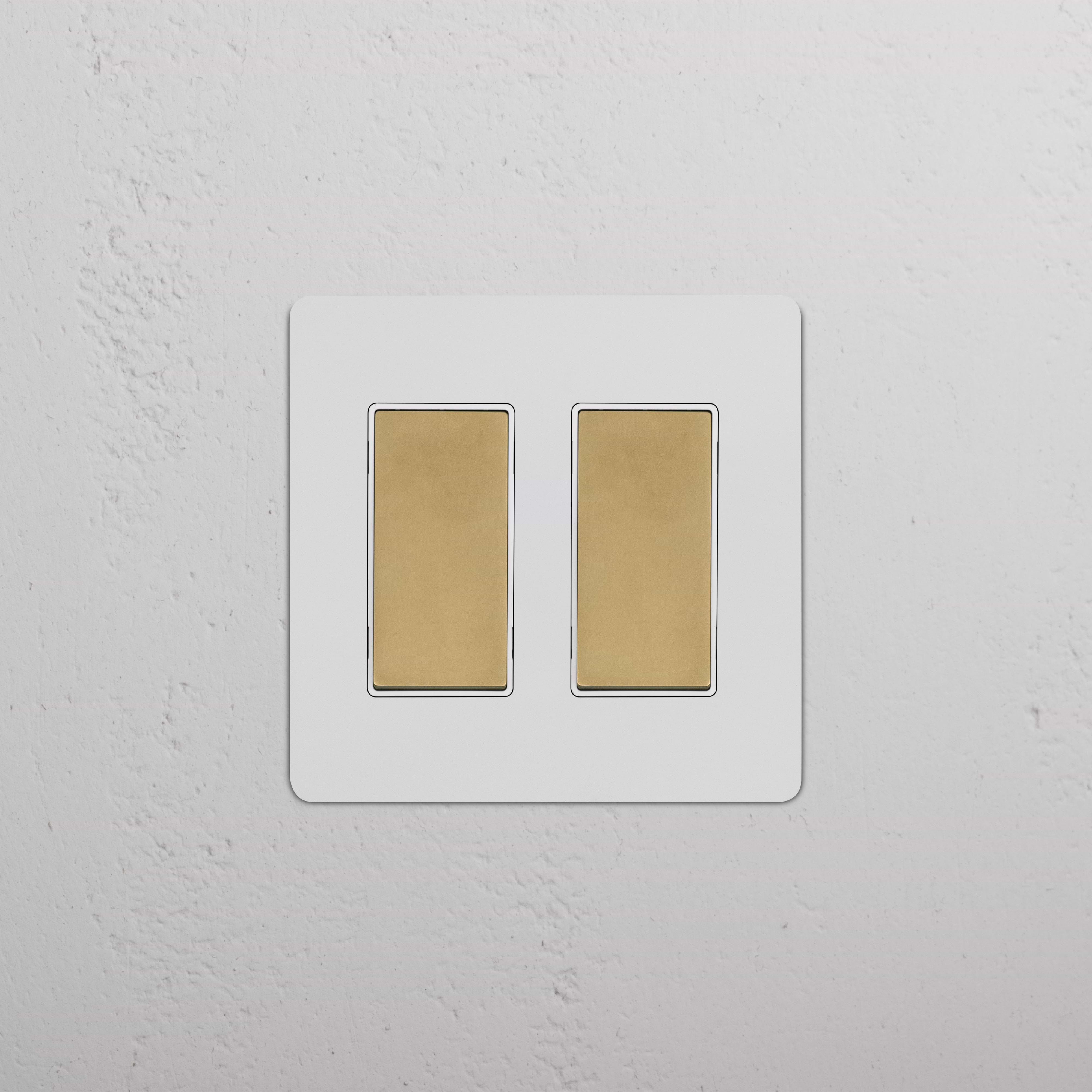 Kew 2G Rocker Switch in paintable antique brass white finish with two white rocker switches.