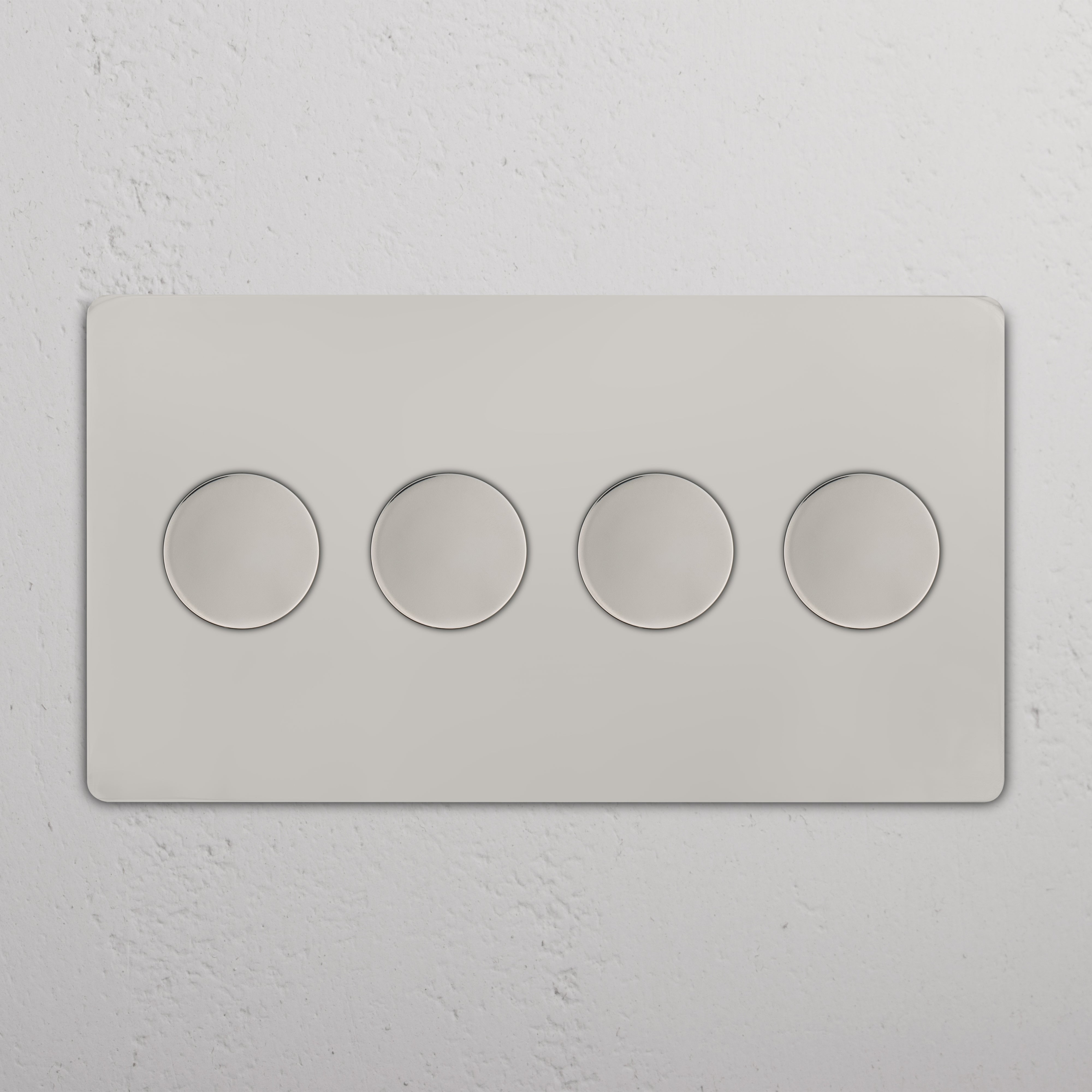 Grove 4G Dimmer Switch in polished nickel with four round dimmer knobs on a wall plate.