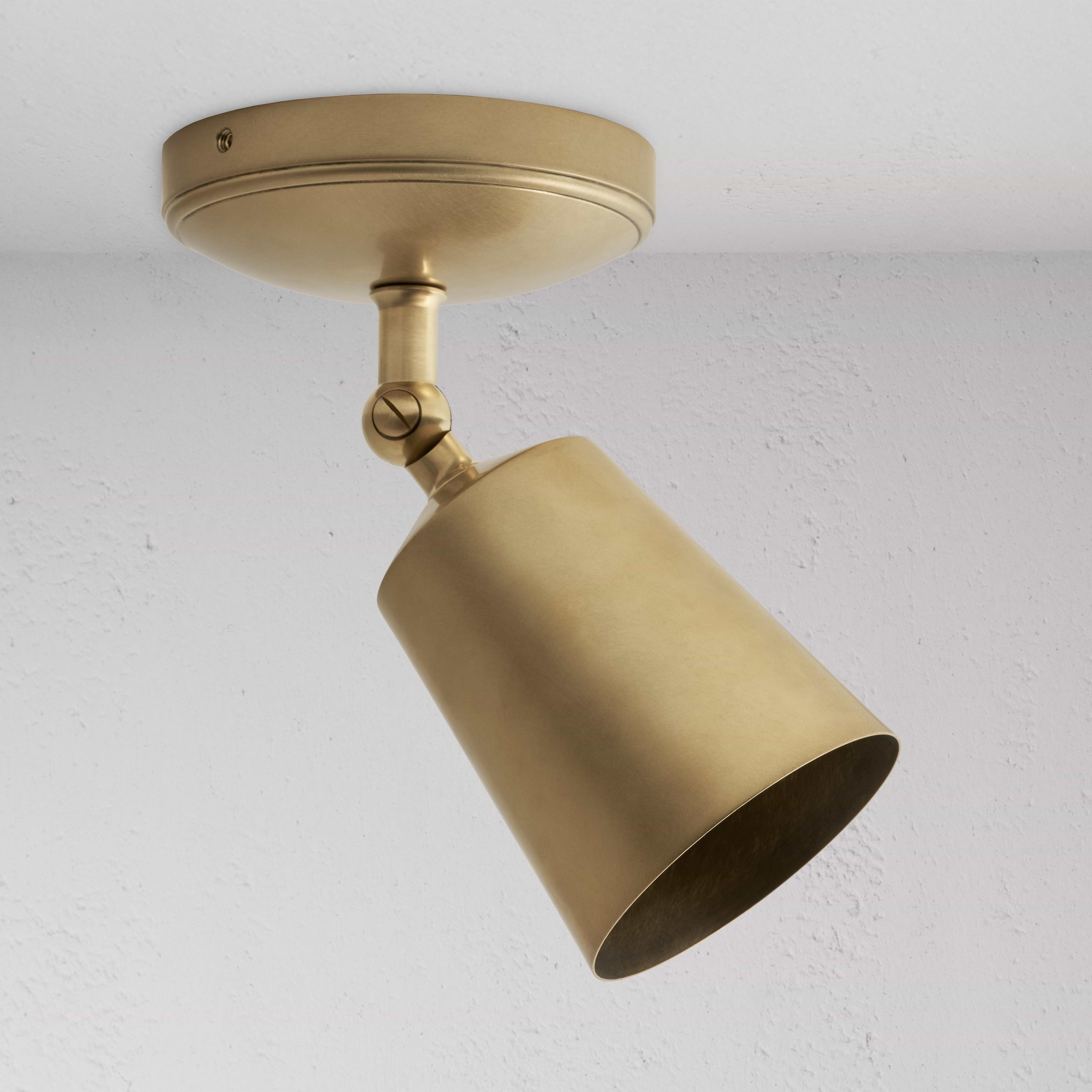 Baylis Single 70mm Spotlight in antique brass, adjustable cylindrical shade on round base for ceiling lighting.