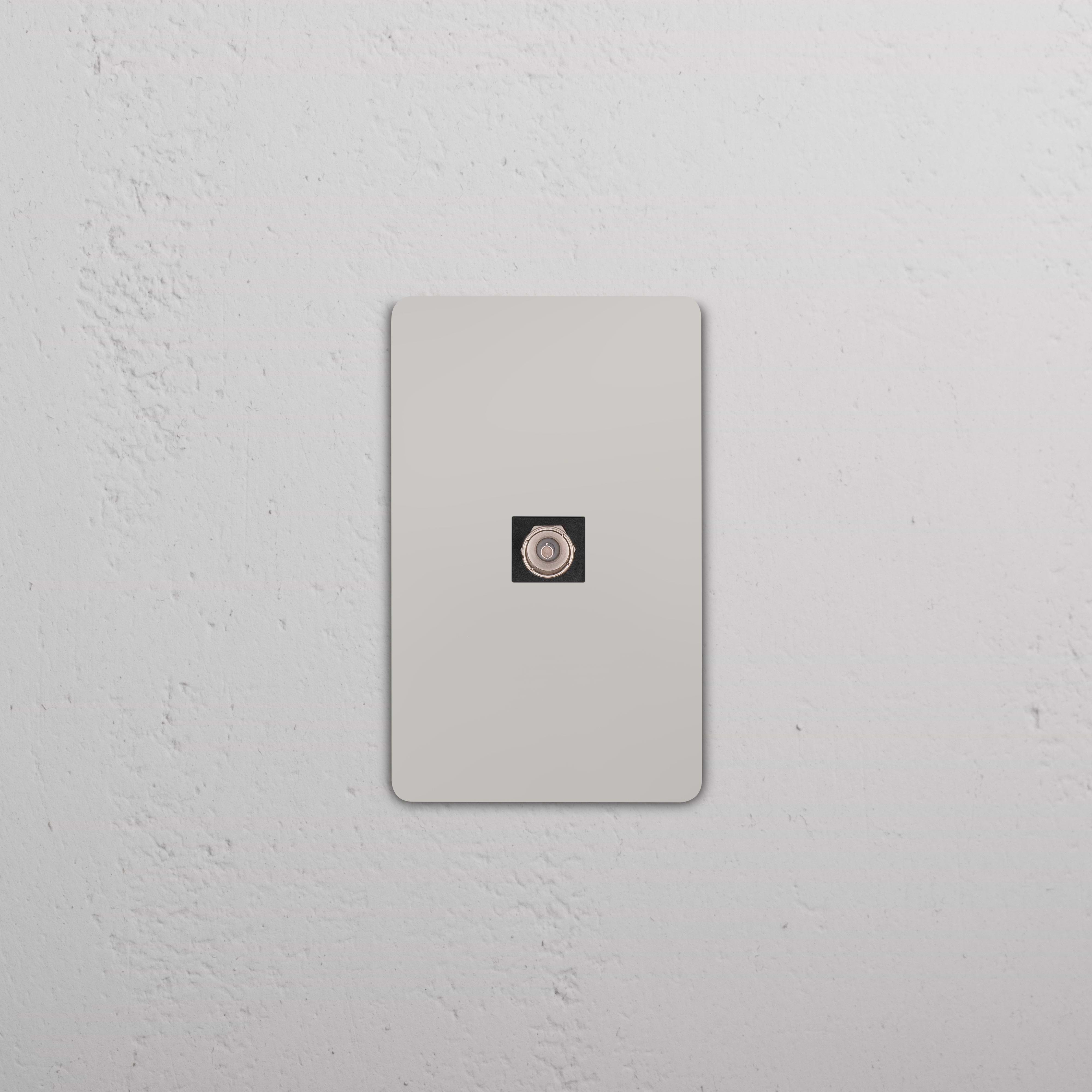 Grove 1G TV Keystone in Polished Nickel Black finish, shown mounted on a white wall plate.