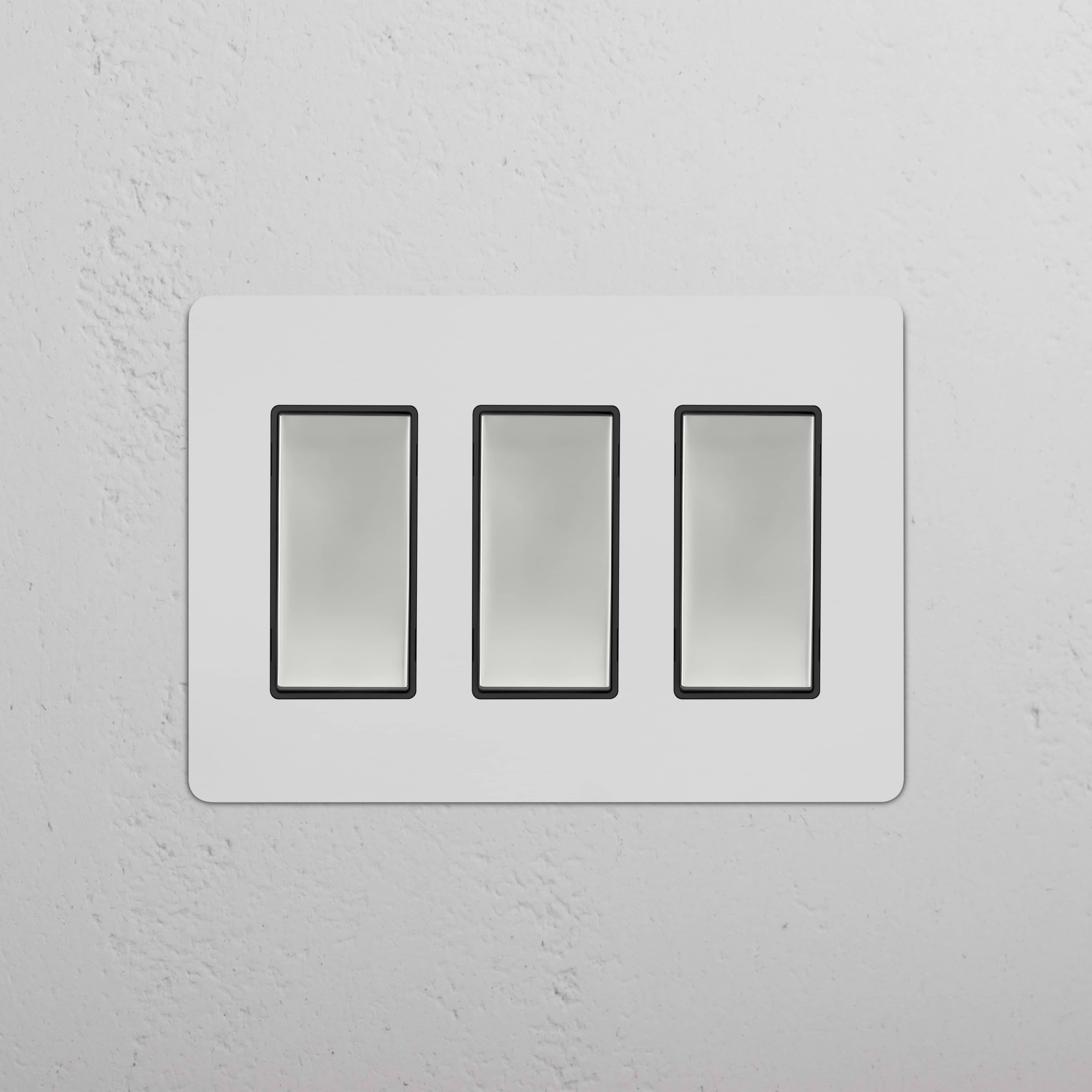 Kew 3G Rocker Switch in paintable polished nickel black with three vertical rocker switches on a rectangular plate.